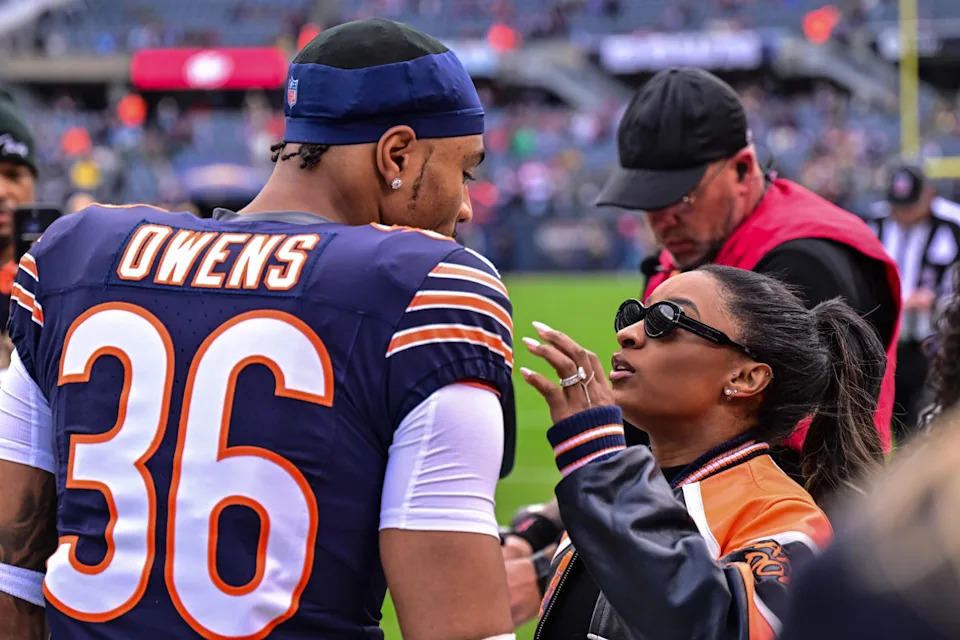 Chicago Bears safety Jonathan Owens (36) and wife Simone Biles before the game against the Green Bay Packers.Daniel Bartel-Imagn Images