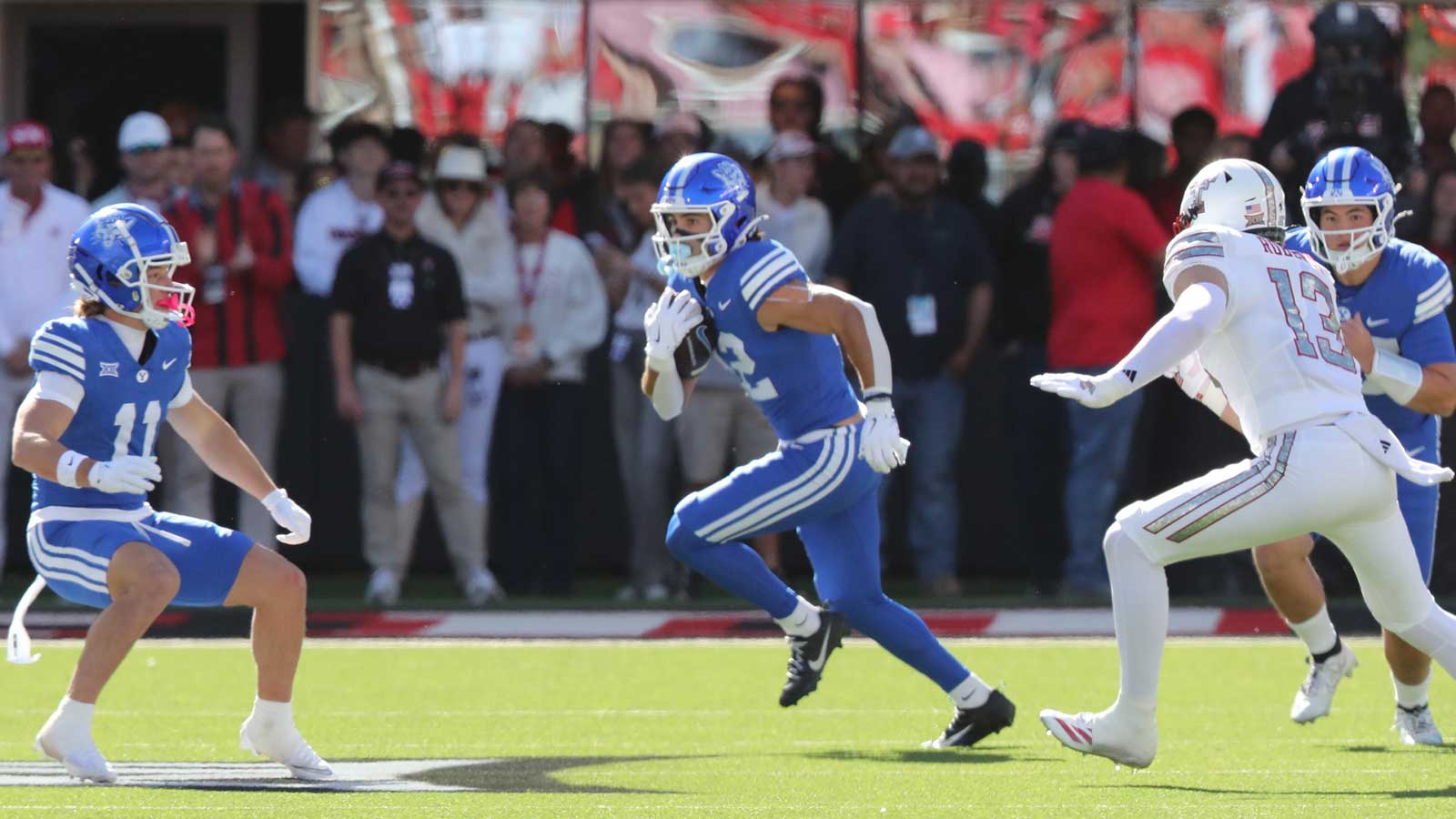 Brigham Young Cougars wide receiver Chase Roberts (2) rushes against Texas Tech Red Raiders defensive end Ben Roberts (13) in the first half at Jones AT&T Stadium. 