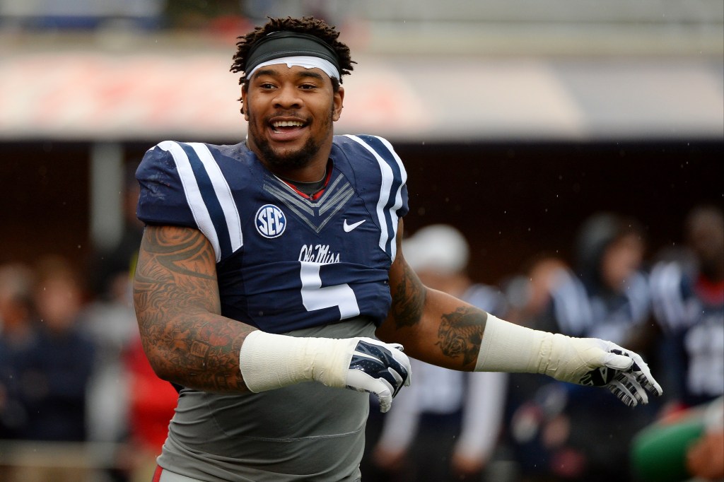 Mississippi defensive tackle Robert Nkemdiche smiles, wearing his uniform during a game.