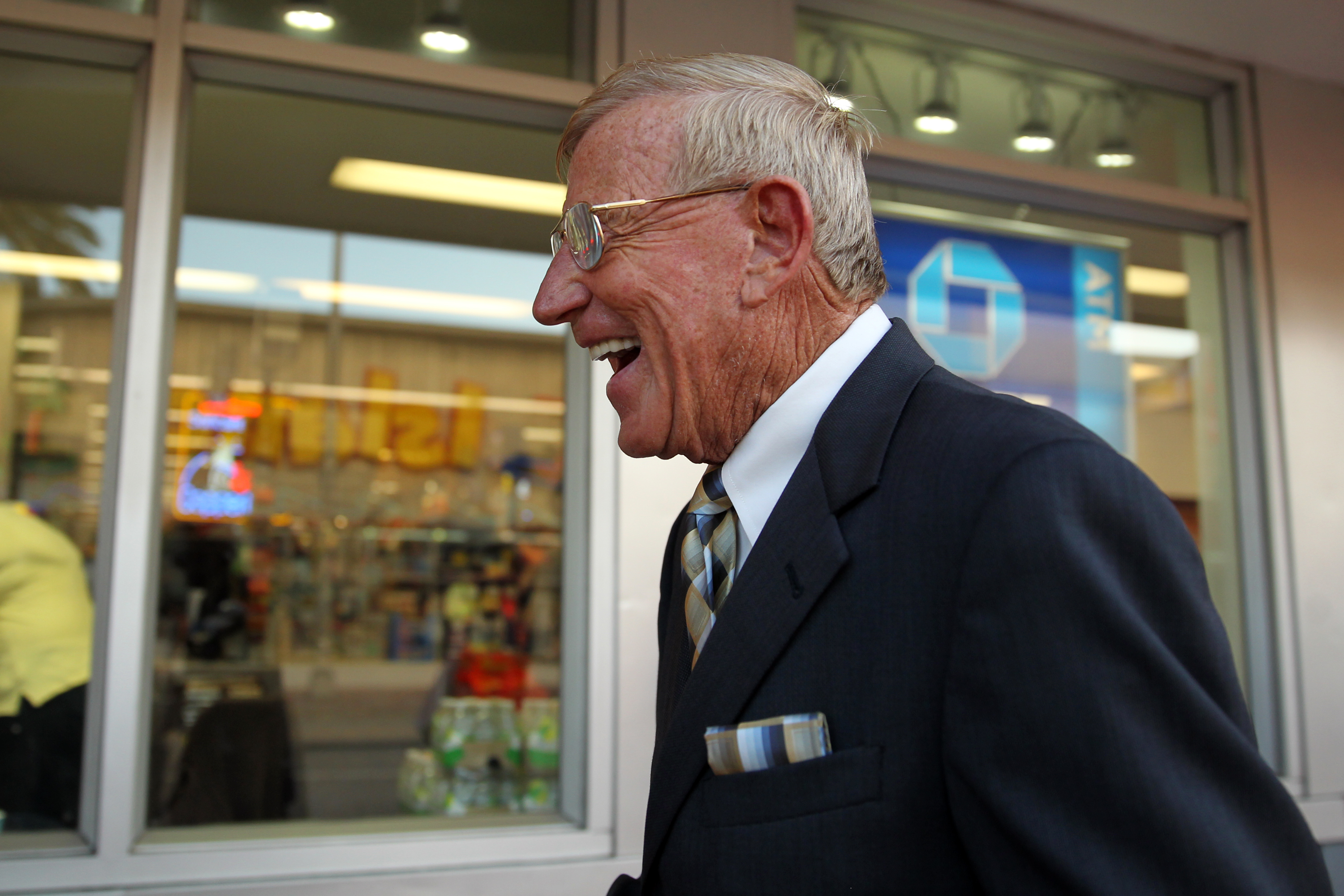 Former Notre Dame head coach Lou Holtz reacts to a...
