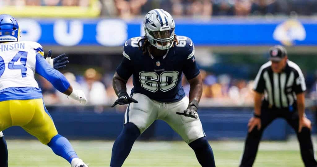 Dallas Cowboys linebacker in action during a game at AT&T Stadium, showcasing team defense and key plays.