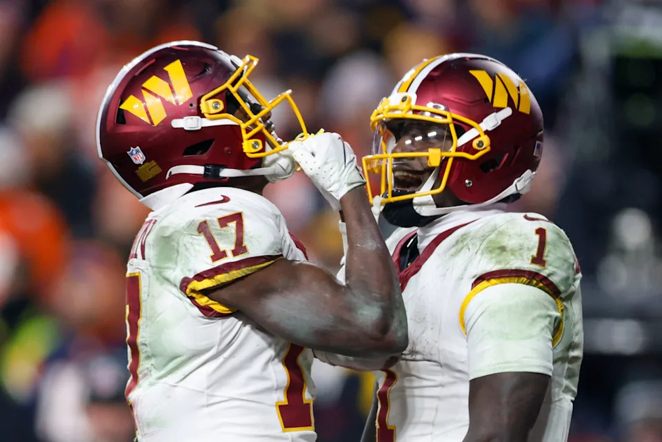 Washington Commanders wide receivers Terry McLaurin and Deebo Samuel celebrate together after scoring a touchdown.Peter Casey-Imagn Images
