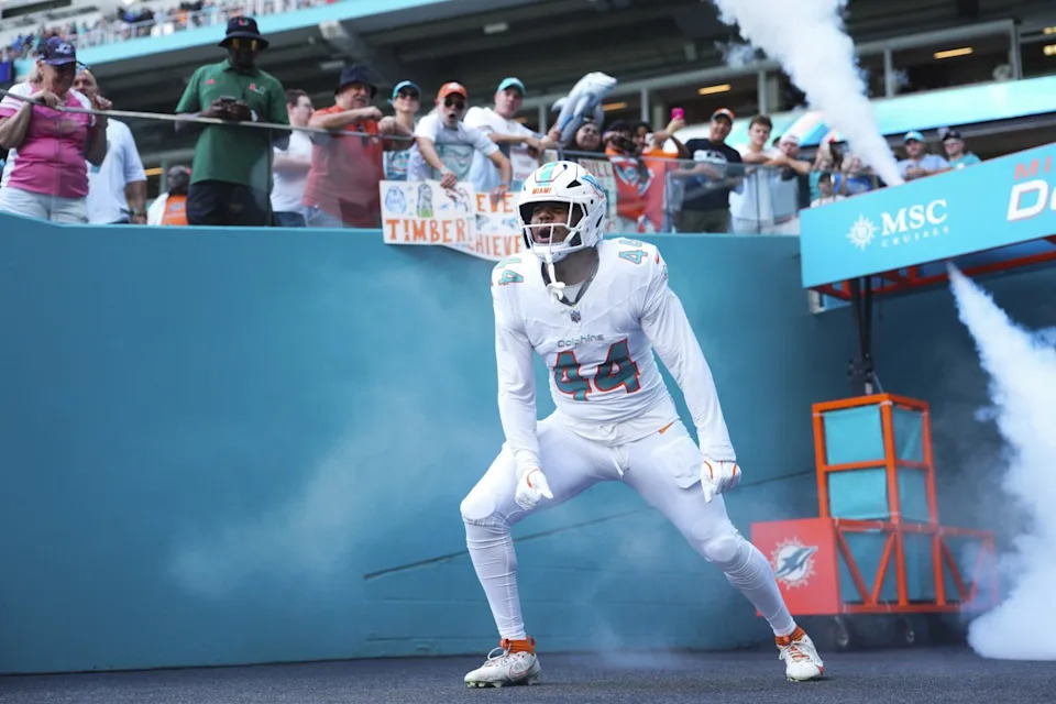 Oct 12, 2025; Miami Gardens, Florida, USA; Miami Dolphins linebacker Chop Robinson (44) enters the field prior to a game against the Los Angeles Chargers at Hard Rock Stadium. Rich Storry-Imagn Images