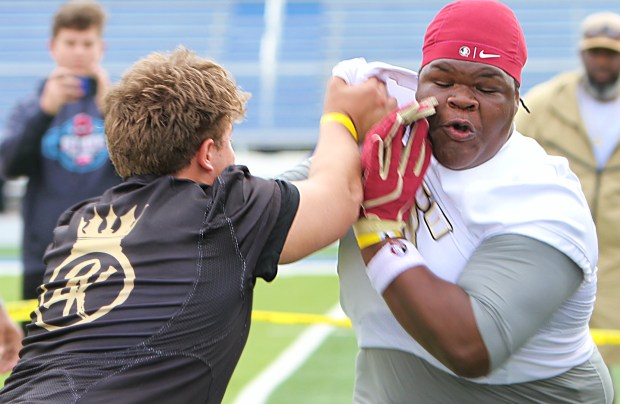 Lake Mary's Slade Wittstock (left) goes up against Pennsylvania defensive tackle Dajour Webb during the 24k Trench Gorillas 5v5 at TFA on Saturday. (Chris Hays/Orlando Sentinel)