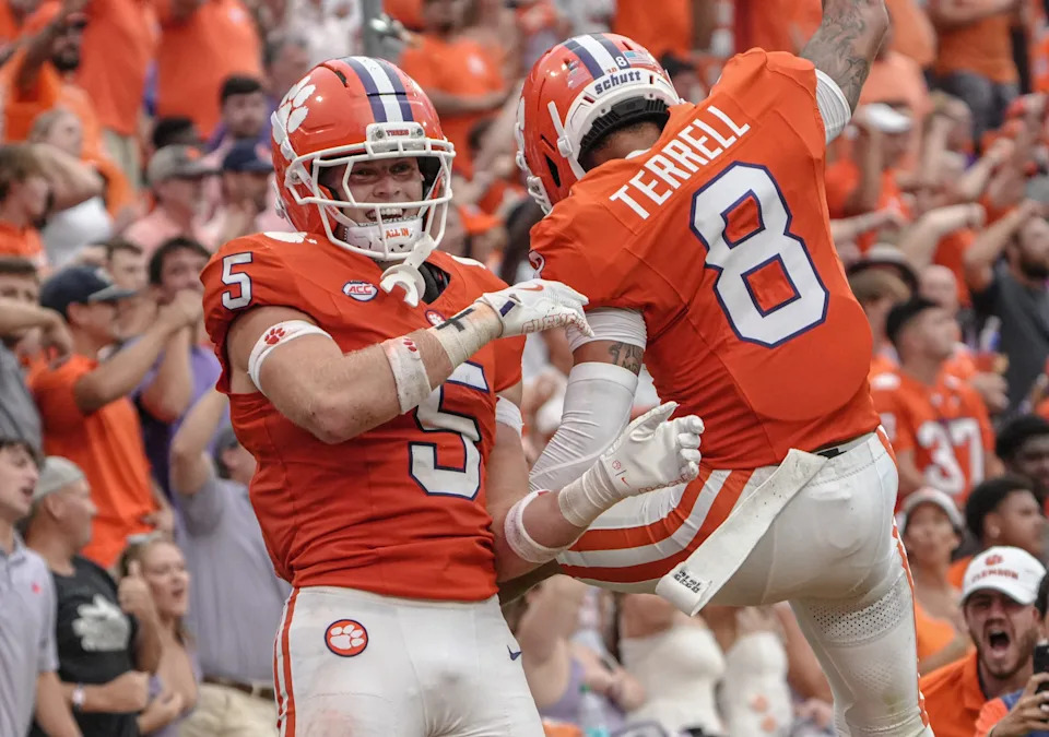 Clemson defensive back Ronan Hanafin (5) is congratulated by cornerback Avieon Terrell (8) after his interception against Troy during the third quarter at Memorial Stadium in Clemson, S.C. Saturday, September 6, 2025.