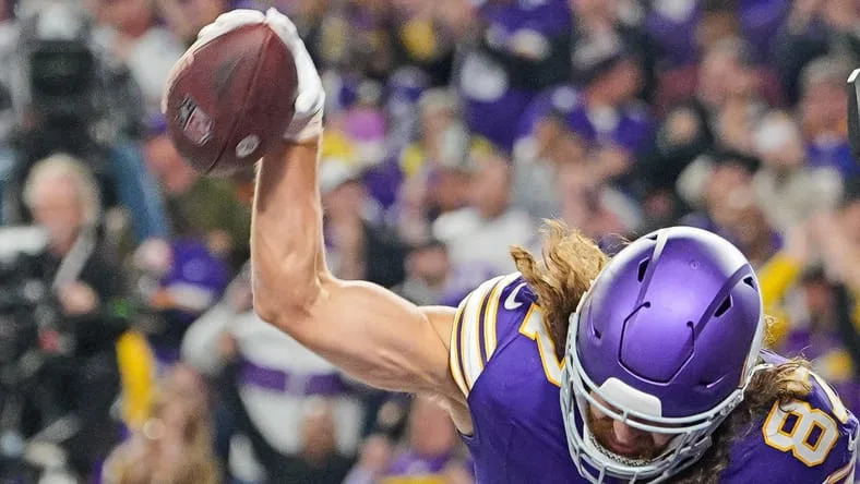T.J. Hockenson celebrating after scoring a touchdown for the Vikings against the Chicago Bears at U.S. Bank Stadium. Vikings free agency predictions