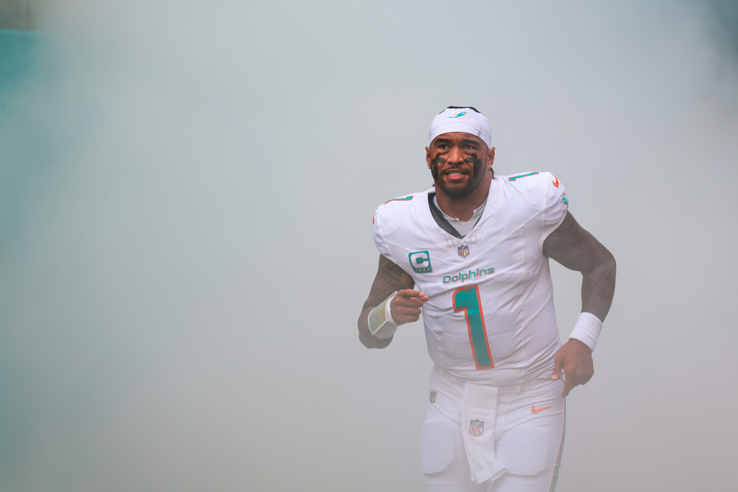 Miami Dolphins quarterback Tua Tagovailoa (1) takes the field prior to a game against the New Orleans Saints at Hard Rock Stadium.
