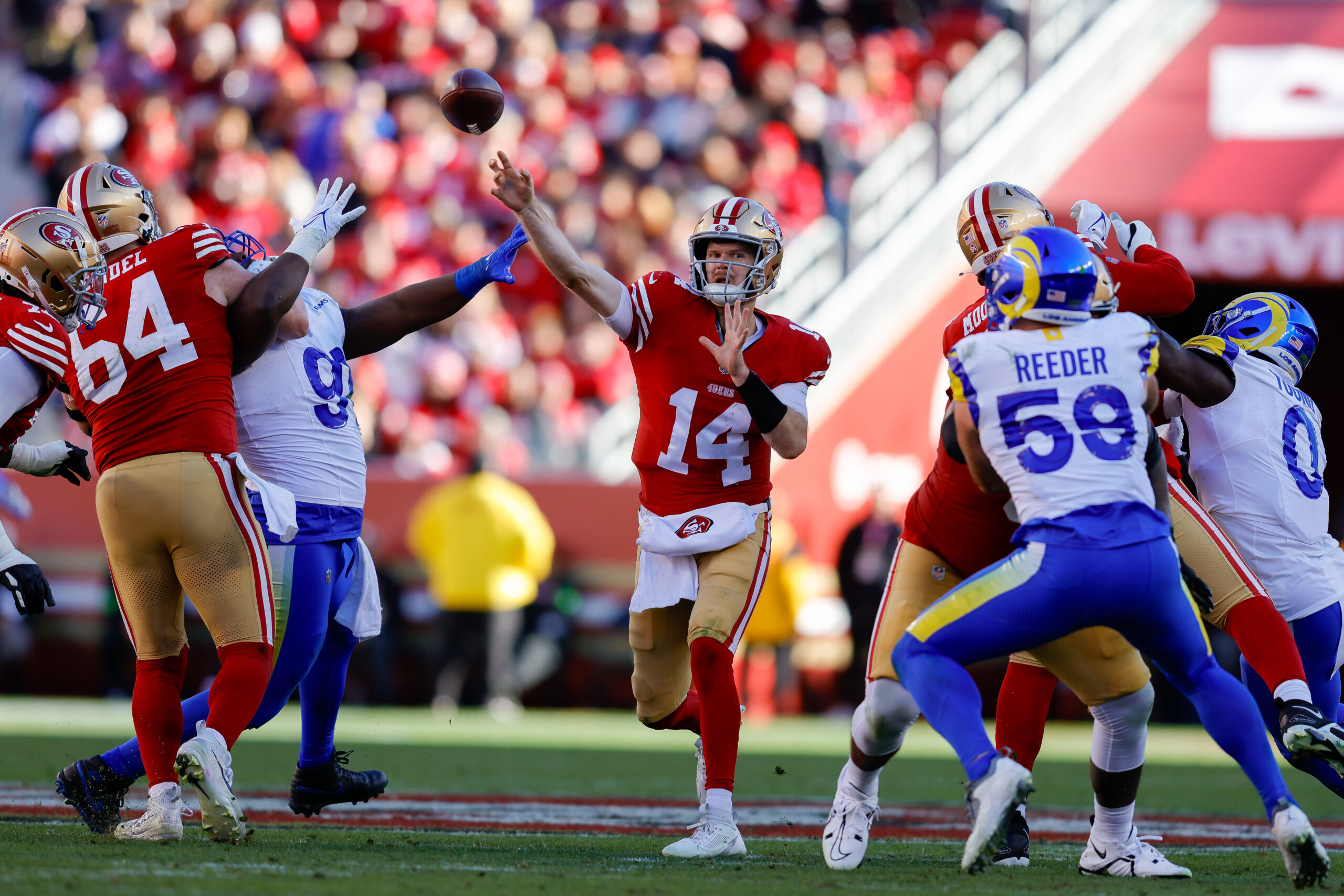 Jan 7, 2024; Santa Clara, California, USA; San Francisco 49ers quarterback Sam Darnold (14) throws a pass during the second quarter against the Los Angeles Rams at Levi’s Stadium. Mandatory Credit: Sergio Estrada-Imagn Images