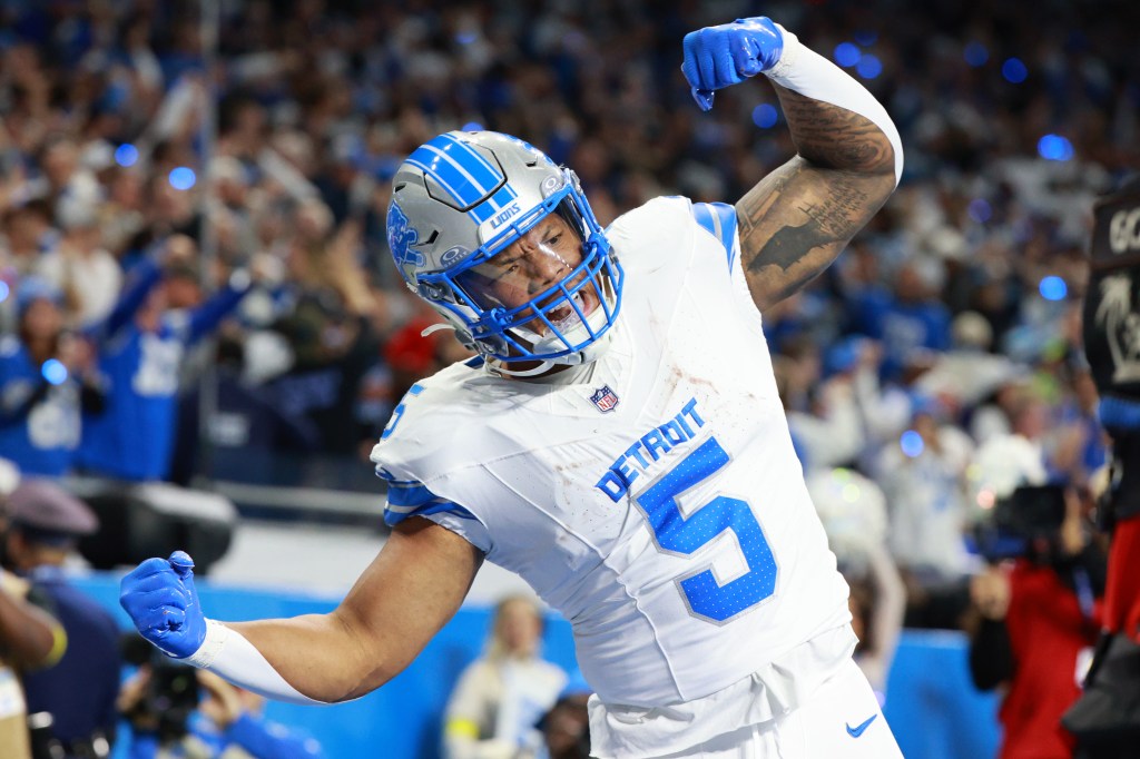 Detroit Lions running back David Montgomery reacting after scoring a touchdown.