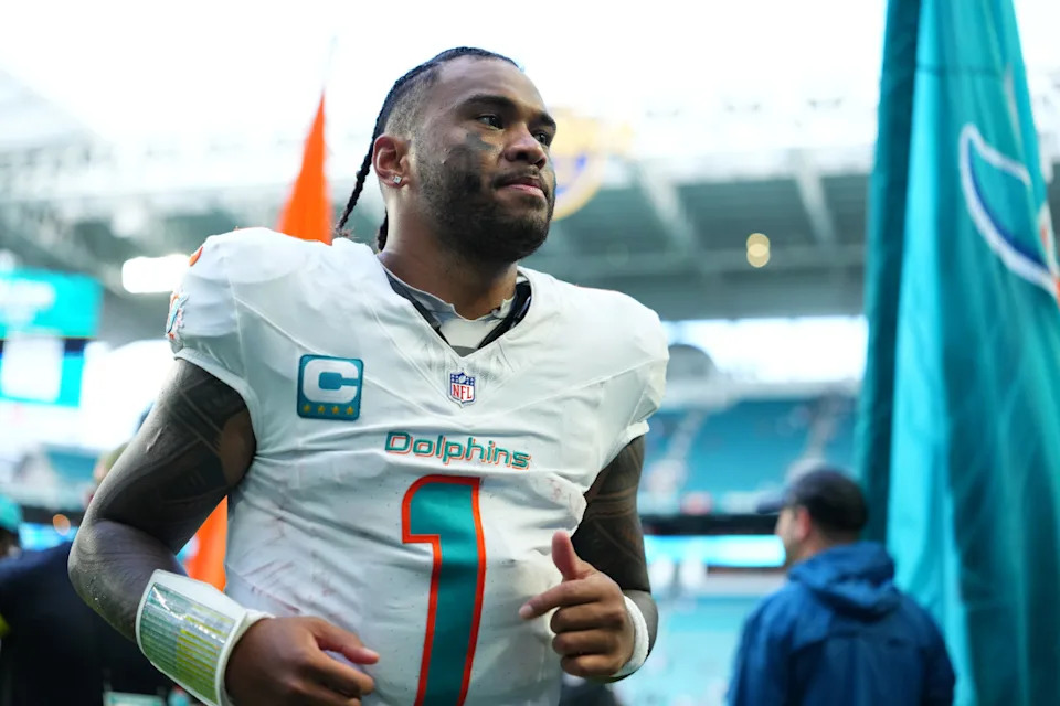 Nov 30, 2025; Miami Gardens, Florida, USA; Miami Dolphins quarterback Tua Tagovailoa (1) leaves the field following a game against the New Orleans Saints at Hard Rock Stadium. Rich Storry-Imagn Images