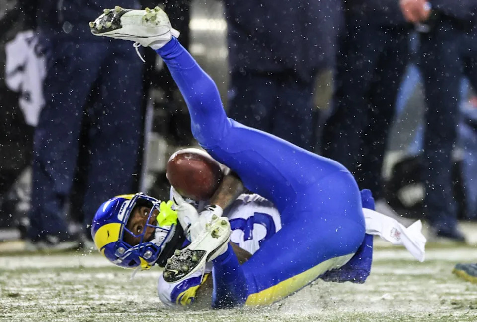 Rams safety Kam Curl falls to the ground as he intercepts a pass from Bears quarterback Caleb Williams (not pictured).