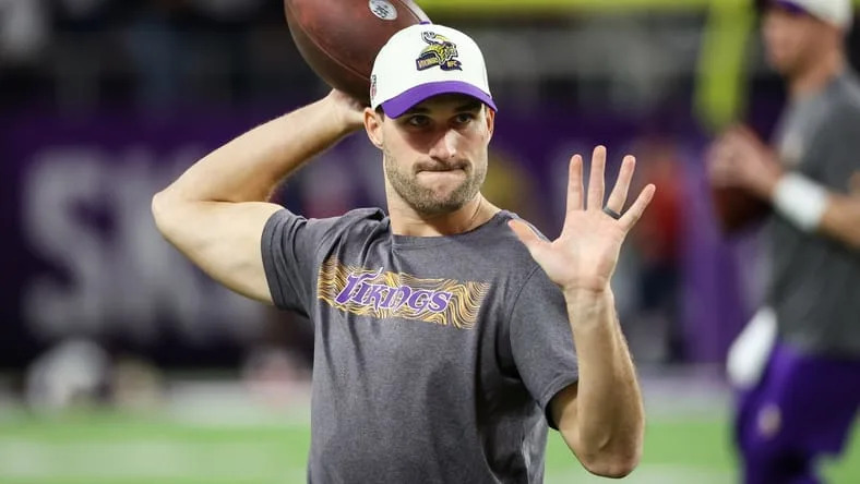 Kirk Cousins warms up before a Vikings game at U.S. Bank Stadium. Vikings rumors 2026