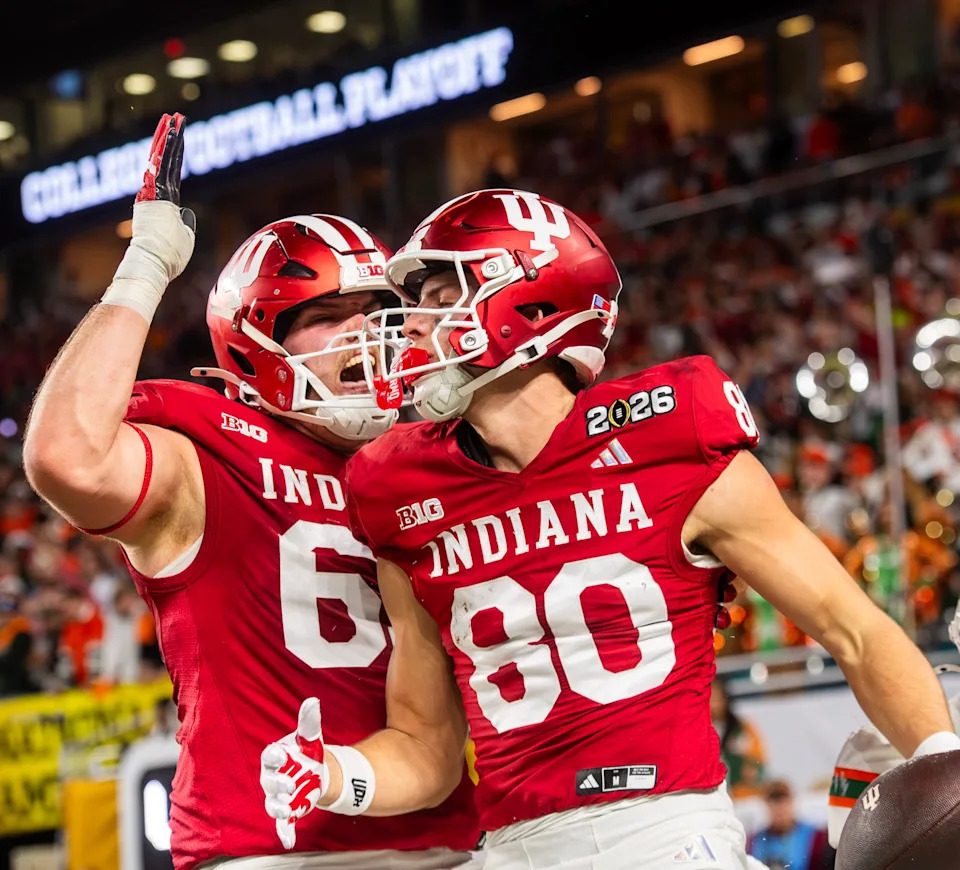 Indiana's Charlie Becker (80) celebrates with Carter Smith (65) on a touchdown that was ruled down before the endzone during the College Football Playoff National Championship college football game at Hard Rock Stadium in Miami Gardens on Monday, Jan. 19, 2026.