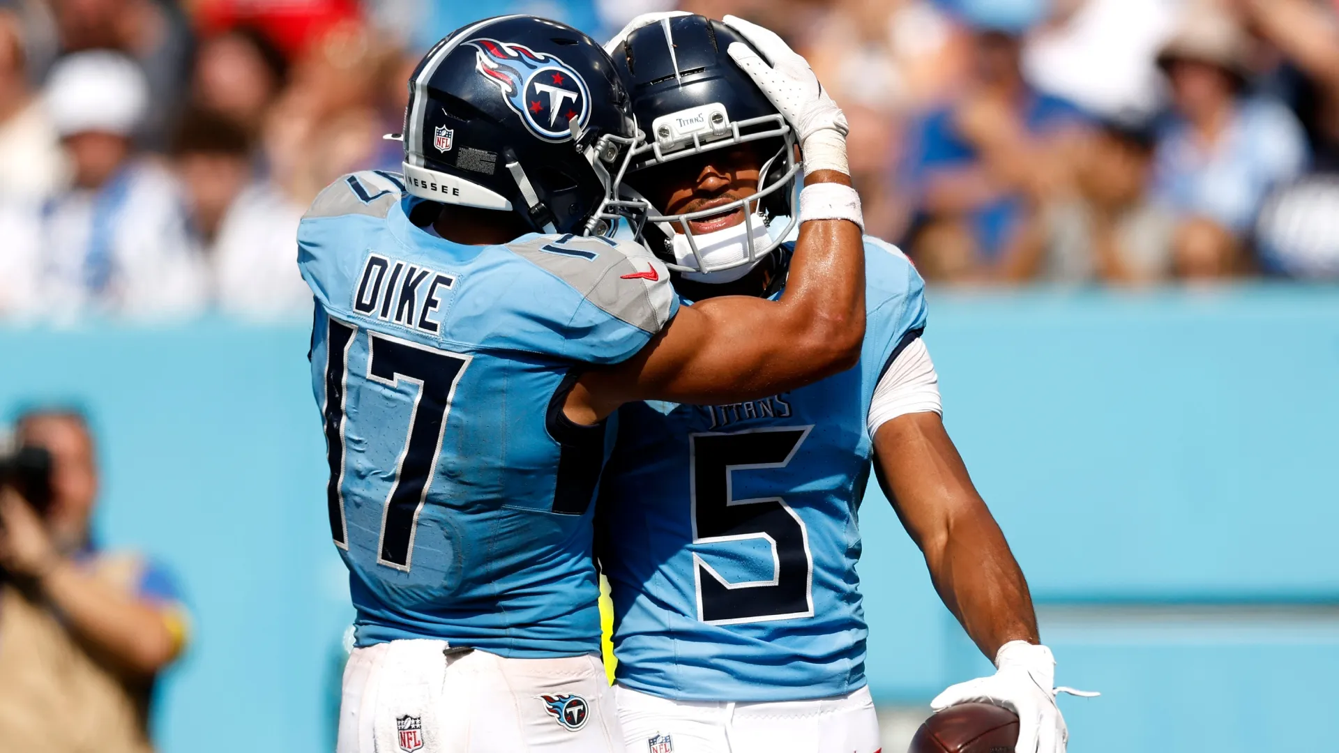 Elic Ayomanor #5 of the Tennessee Titans celebrates with teammate Chimere Dike #17 