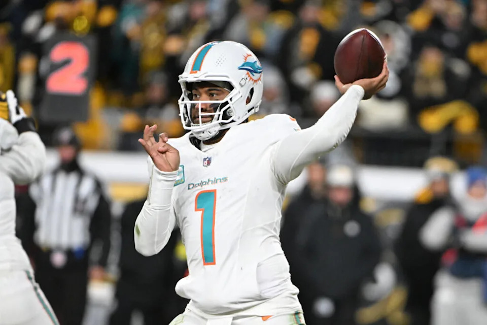 Dec 15, 2025; Pittsburgh, Pennsylvania, USA; Miami Dolphins quarterback Tua Tagovailoa (1) throws in the third quarter against the Pittsburgh Steelers at Acrisure Stadium. Mandatory Credit: Barry Reeger-Imagn Images