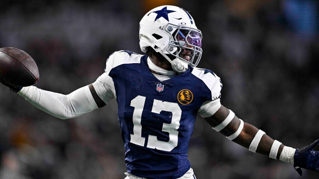 Cowboys 2026 Defensive Identity is Changing Dallas Cowboys defensive changes featured by a Cowboys defender in a navy No. 13 jersey holding the football.