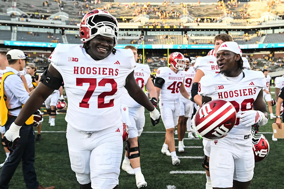 Sep 27, 2025; Iowa City, Iowa, USA; Indiana Hoosiers offensive lineman Adedamola Ajani (72) and running back Khobie Martin (28) react after the game against the Iowa Hawkeyes at Kinnick Stadium.