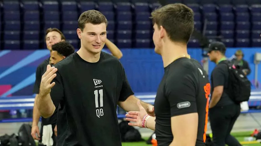Indiana quarterback Fernando Mendoza (QB11) greets Alabama quarterback Ty Simpson