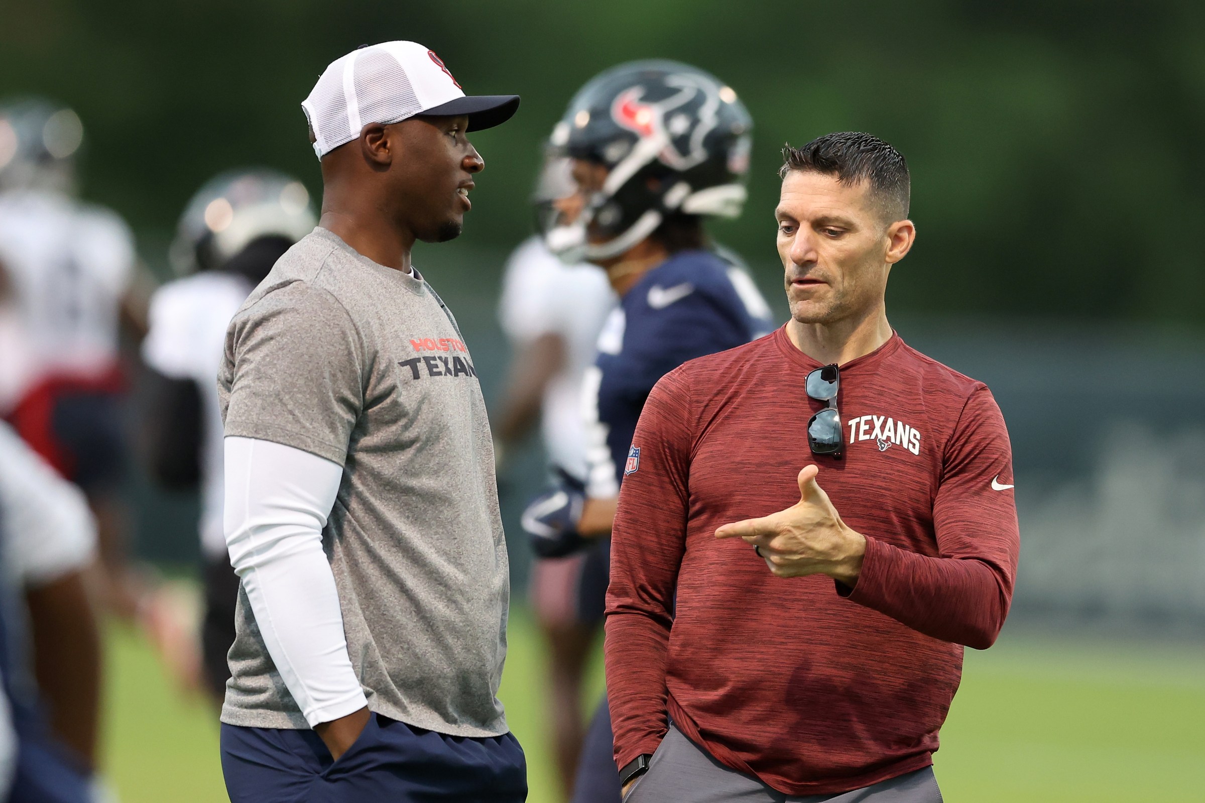 HOUSTON, TEXAS - JUNE 05: Head coach DeMeco Ryans of the Houston Texans talks with general manager Nick Caserio during mandatory minicamp at Houston Methodist Training Center on June 05, 2024 in Houston, Texas. (Photo by Tim Warner/Getty Images)