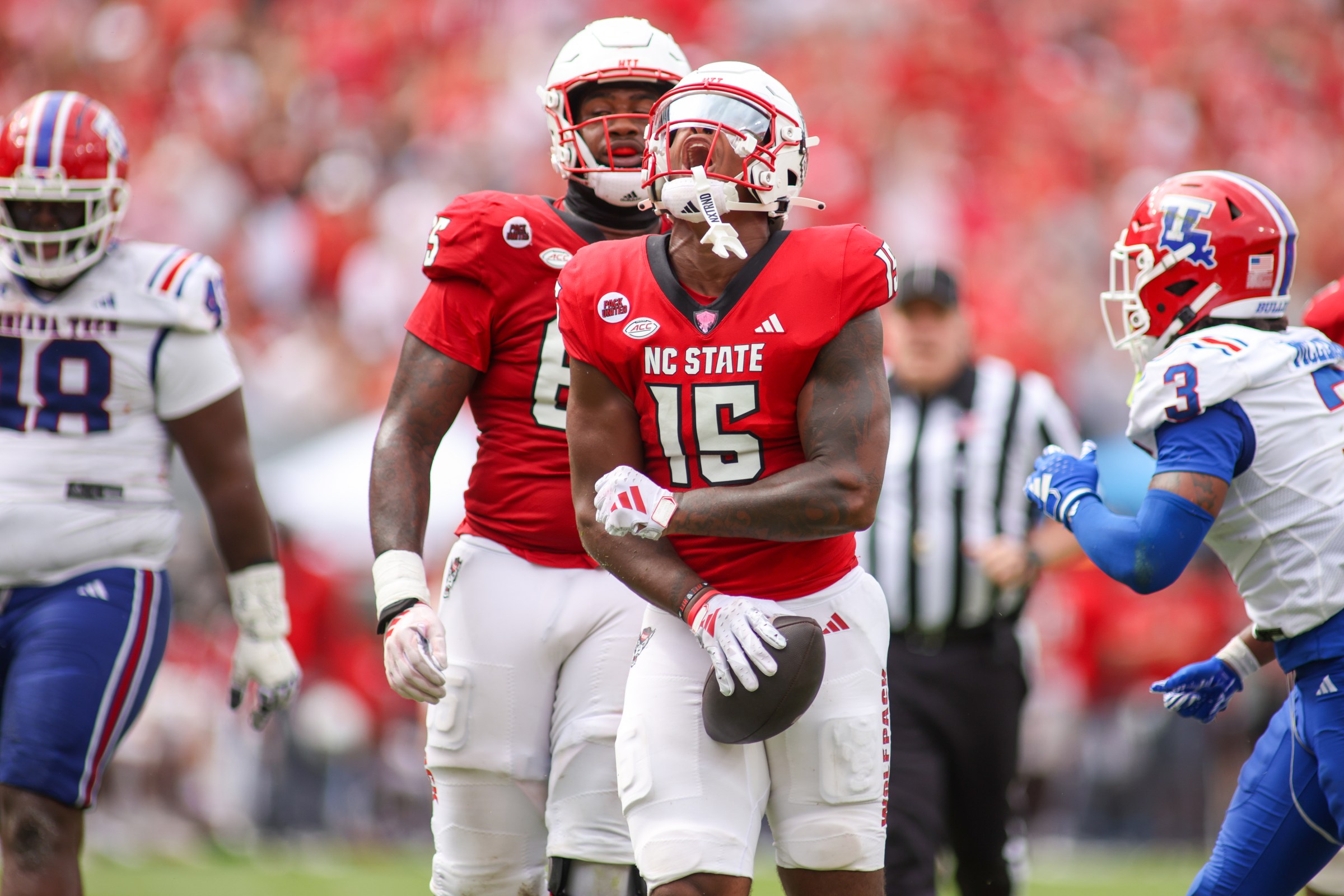 RALEIGH, NC - SEPTEMBER 14: North Carolina State Wolfpack tight end Justin Joly (15) celebrates the first down during the college football game between the North Carolina State Wolfpack and the Louisiana Tech Bulldogs on September 14, 2024 at Carter-Finley Stadium in Raleigh, NC. (Photo by Nicholas Faulkner/Icon Sportswire via Getty Images)