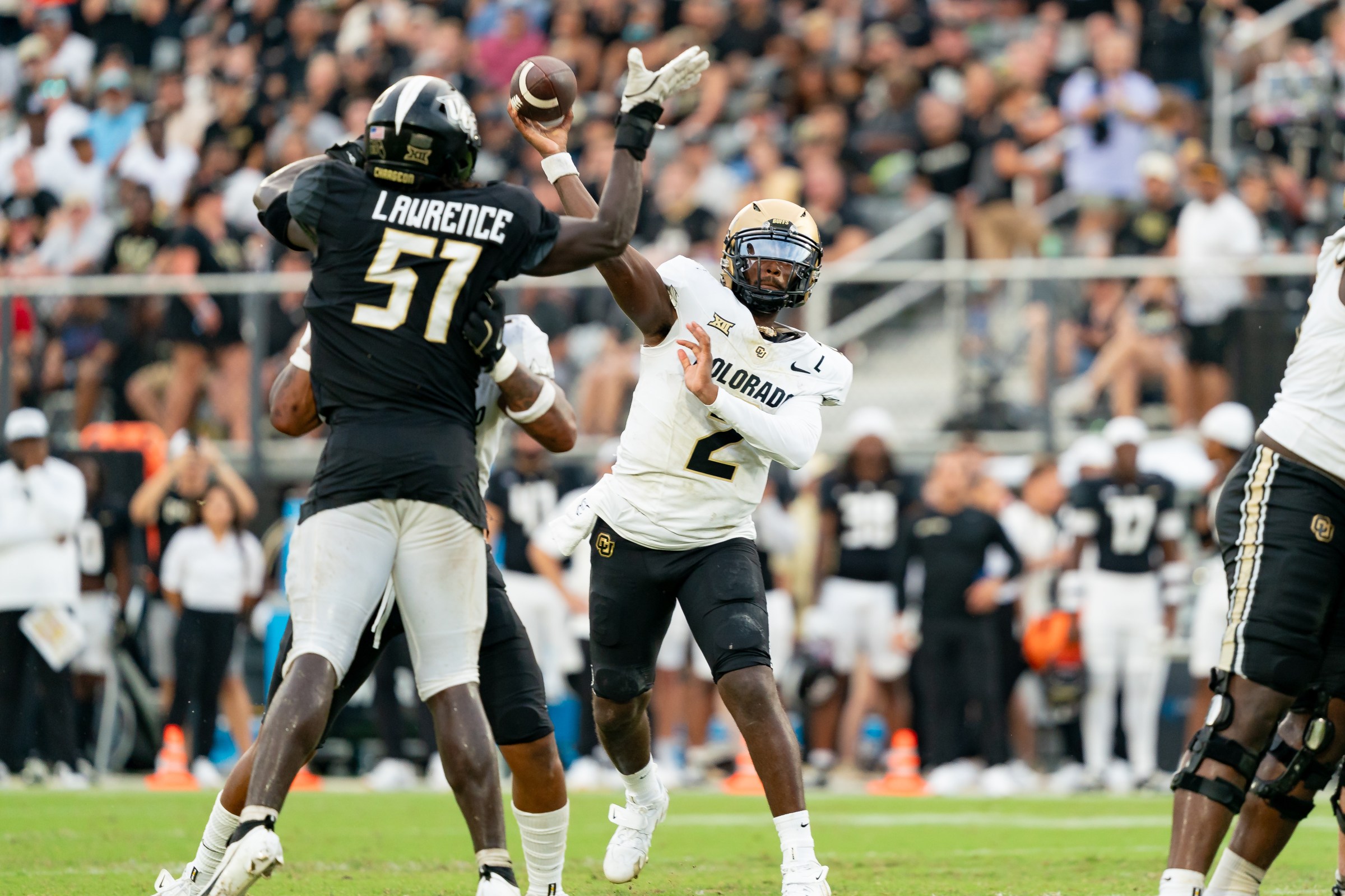 ORLANDO, FL - SEPTEMBER 28: Colorado Buffaloes quarterback Shedeur Sanders (2) throws over UCF Knights defensive end Malachi Lawrence (51) during a college football game between the Colorado Buffaloes and the UCF Knights on September 28th, 2024 at FBC Mortgage Stadium in Orlando, FL. (Photo by Chris Leduc/Icon Sportswire via Getty Images)