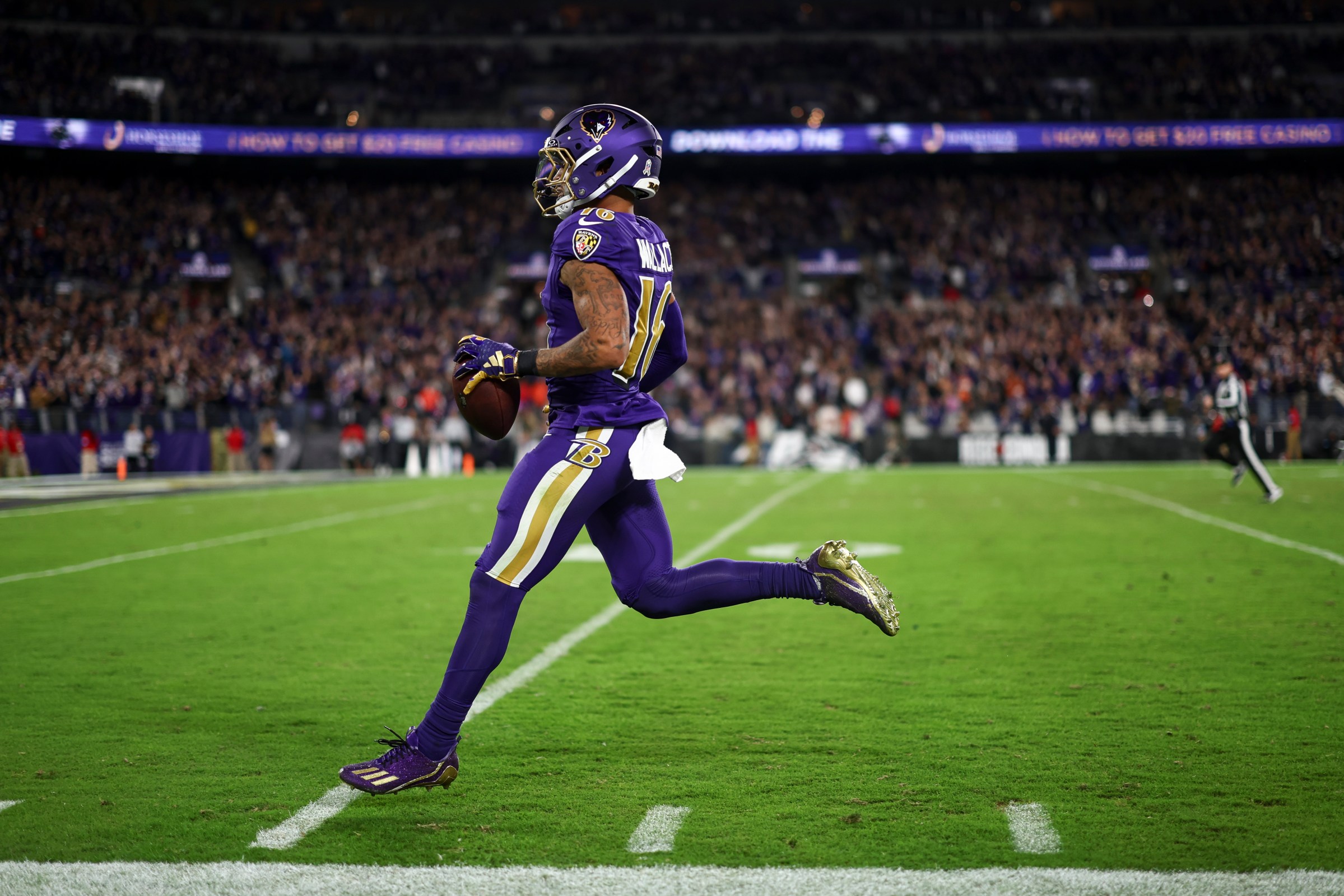Tylan Wallace #16 of the Baltimore Ravens scores a touchdown