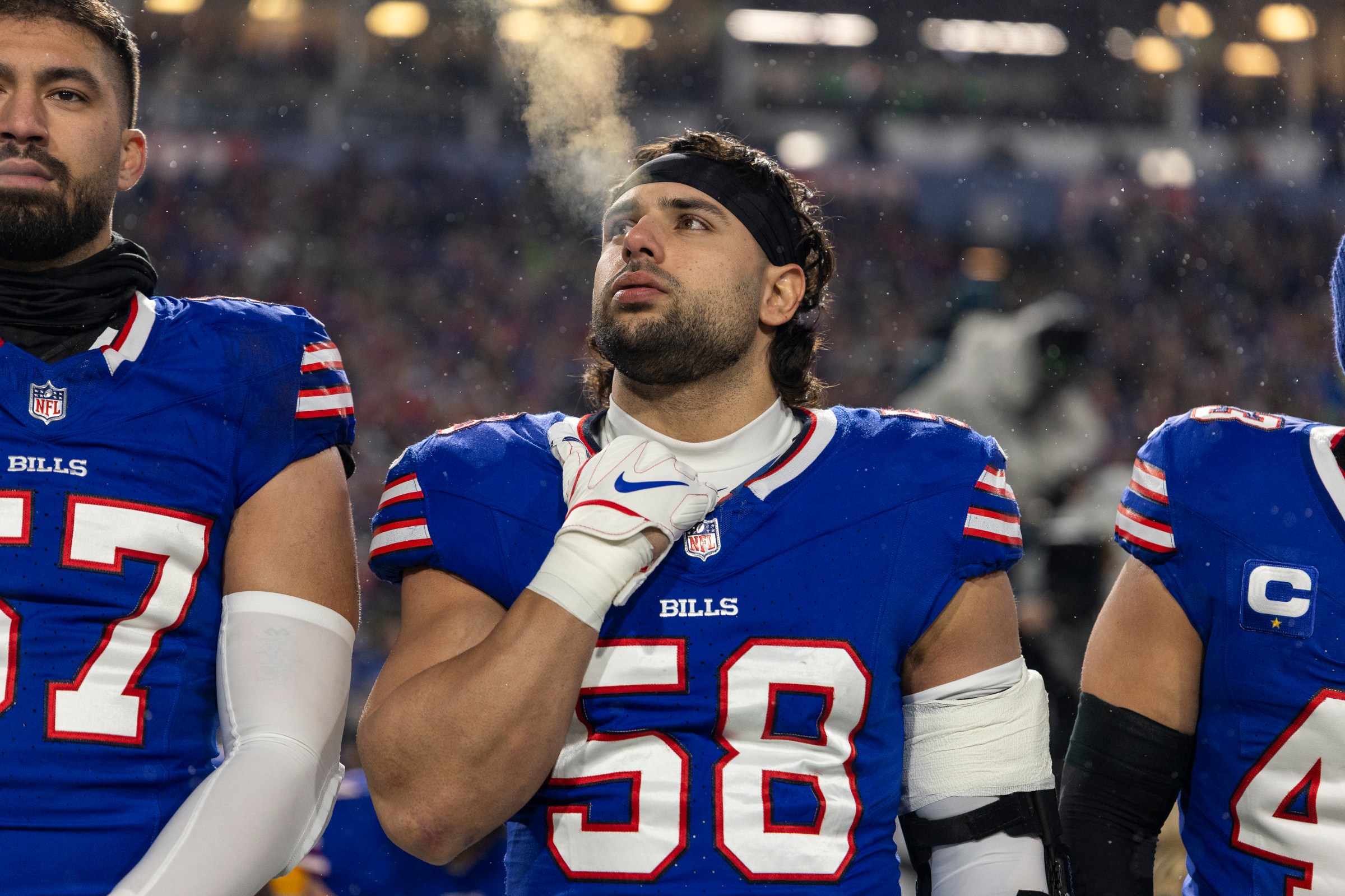 ORCHARD PARK, NEW YORK - JANUARY 19: Matt Milano #58 of the Buffalo Bills looks on during the national anthem prior to an NFL Football game against the Baltimore Ravens at Highmark Stadium on January 19, 2025 in Orchard Park, New York. (Photo by Michael Owens/Getty Images)
