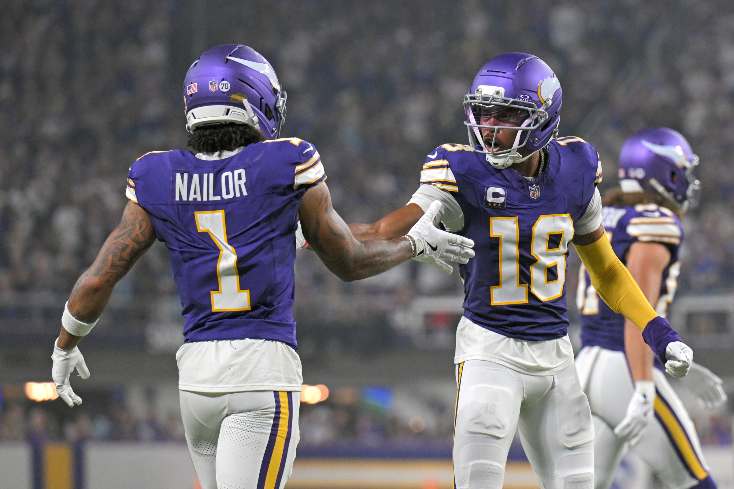 MINNEAPOLIS, MN - SEPTEMBER 14: Minnesota Vikings wide receiver Jalen Nailor (1) celebrates his 17-yard completion with Minnesota Vikings wide receiver Justin Jefferson (18) during the second quarter of a NFL game between the Minnesota Vikings and Atlanta Falcons on September 14, 2025, at U.S. Bank Stadium in Minneapolis, MN. (Photo by Nick Wosika/Icon Sportswire via Getty Images)