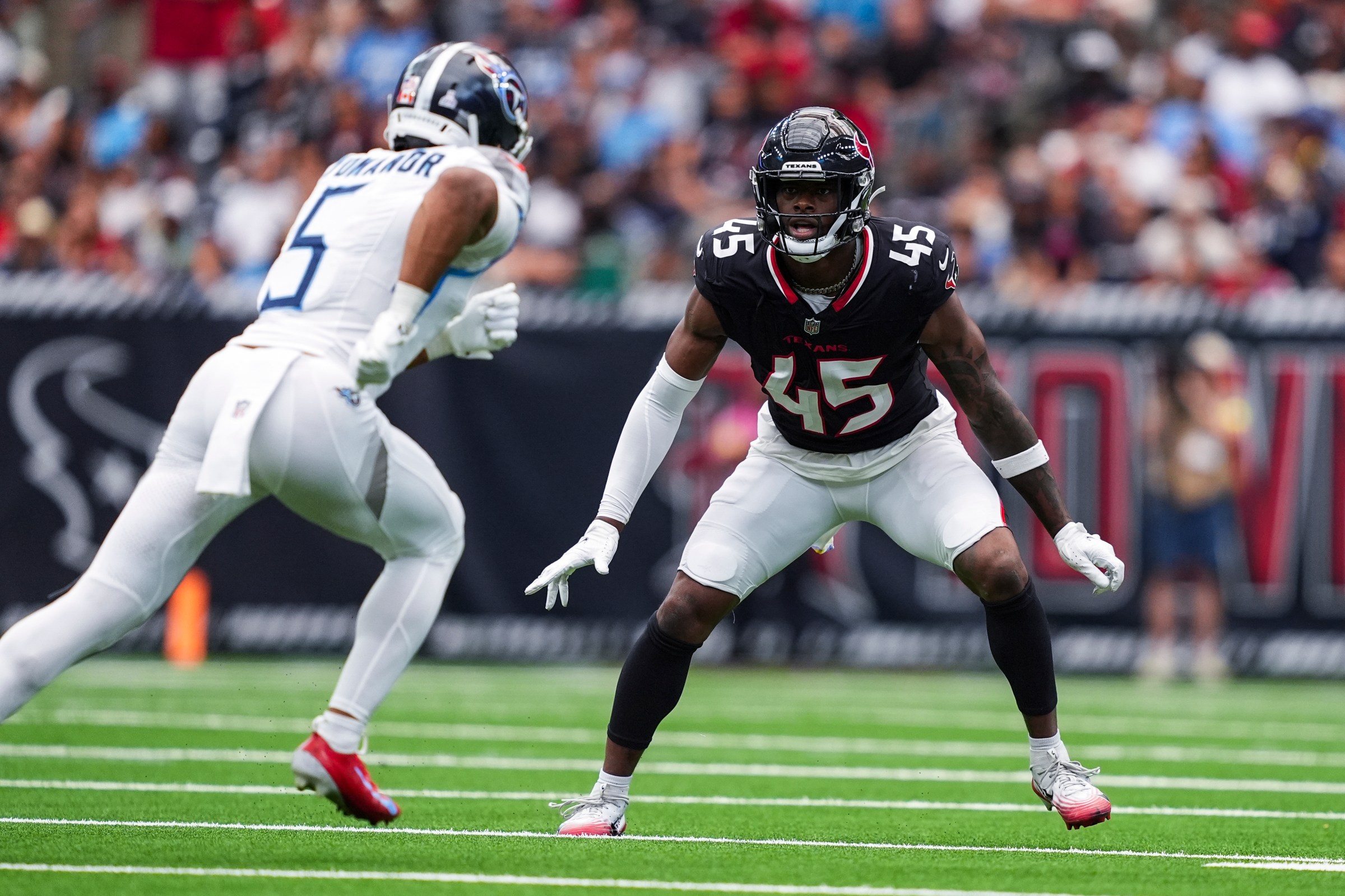 HOUSTON, TEXAS - SEPTEMBER 28: EJ. Speed #45 of the Houston Texans defends in coverage during an NFL football game against the Tennessee Titans at NRG Stadium on September 28, 2025 in Houston, Texas. (Photo by Perry Knotts/Getty Images)