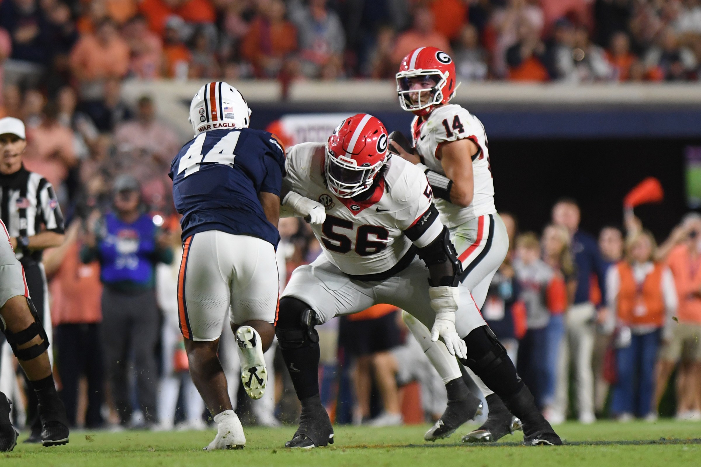 AUBURN, AL - OCTOBER 11: Offensive lineman Micah Morris #56 of the Georgia Bulldogs blocks defensive lineman Darrion Smith #44 of the Auburn Tigers during the college football game between the Georgia Bulldogs and the Auburn Tigers on October 11, 2025, at Jordan-Hare Stadium in Auburn, AL. (Photo by Jeffrey Vest/Icon Sportswire via Getty Images)
