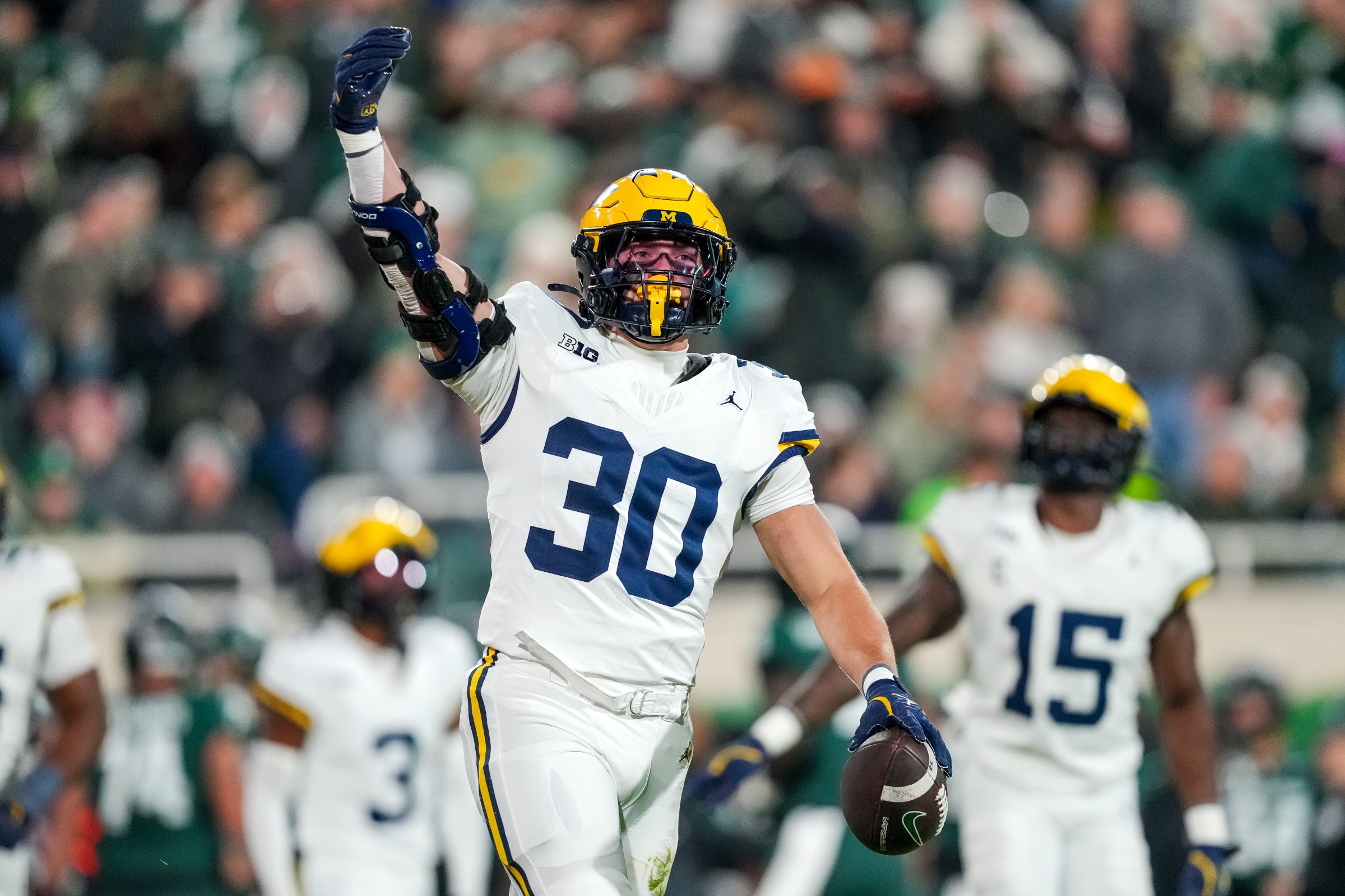 EAST LANSING, MICHIGAN - OCTOBER 25: Jimmy Rolder #30 of the Michigan Wolverines celebrates after a fumble recovery against the Michigan State Spartans during the first quarter at Spartan Stadium on October 25, 2025 in East Lansing, Michigan. (Photo by Nic Antaya/Getty Images)