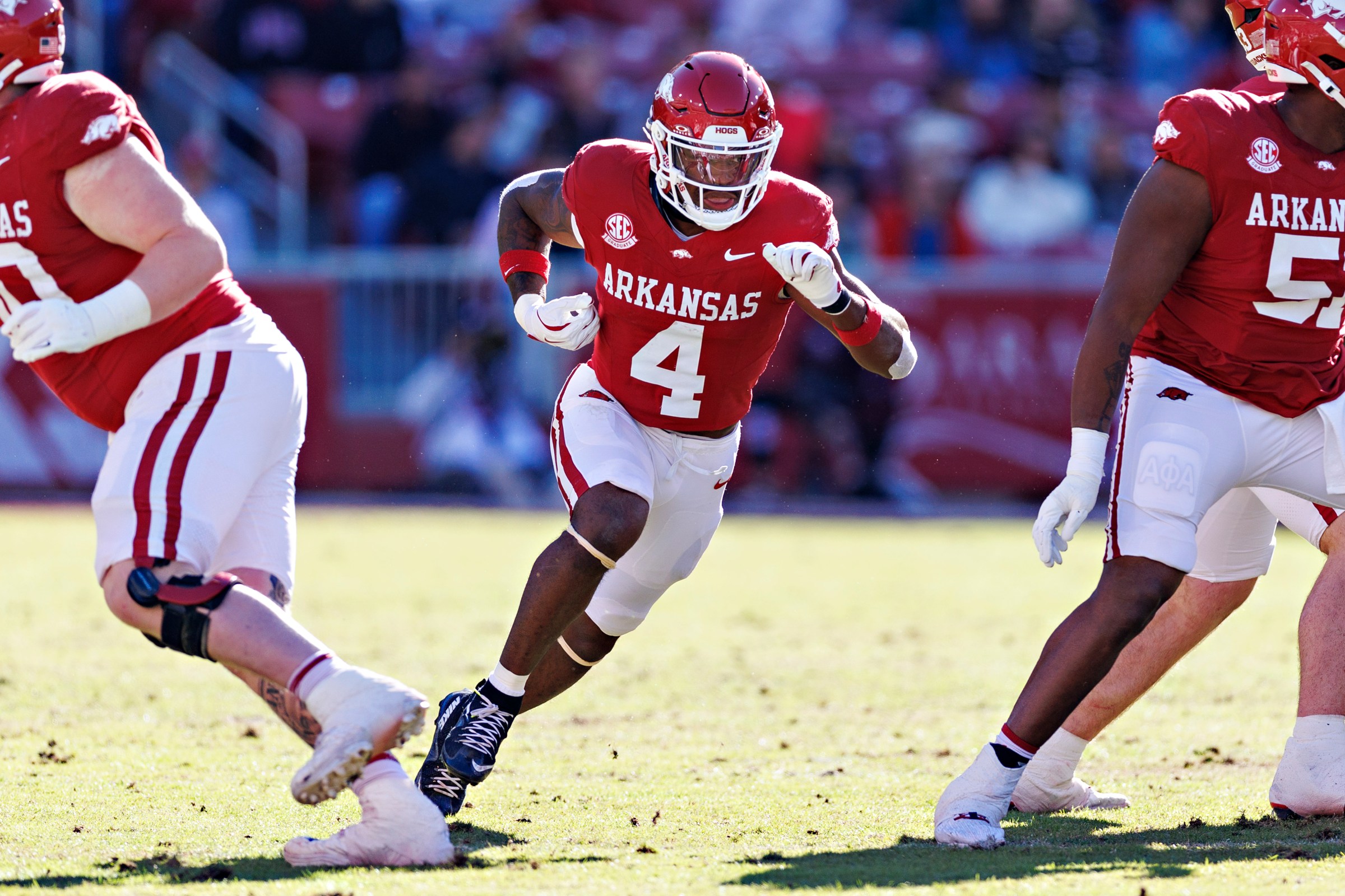 FAYETTEVILLE, ARKANSAS - NOVEMBER 01: Mike Washington Jr. #4 of the Arkansas Razorbacks acts like he is running the ball during a game against the Mississippi State Bulldogs at Donald W. Reynolds Razorback Stadium on November 01, 2025 in Fayetteville, Arkansas. The Bulldogs defeated the Razorbacks 38-35. (Photo by Wesley Hitt/Getty Images)