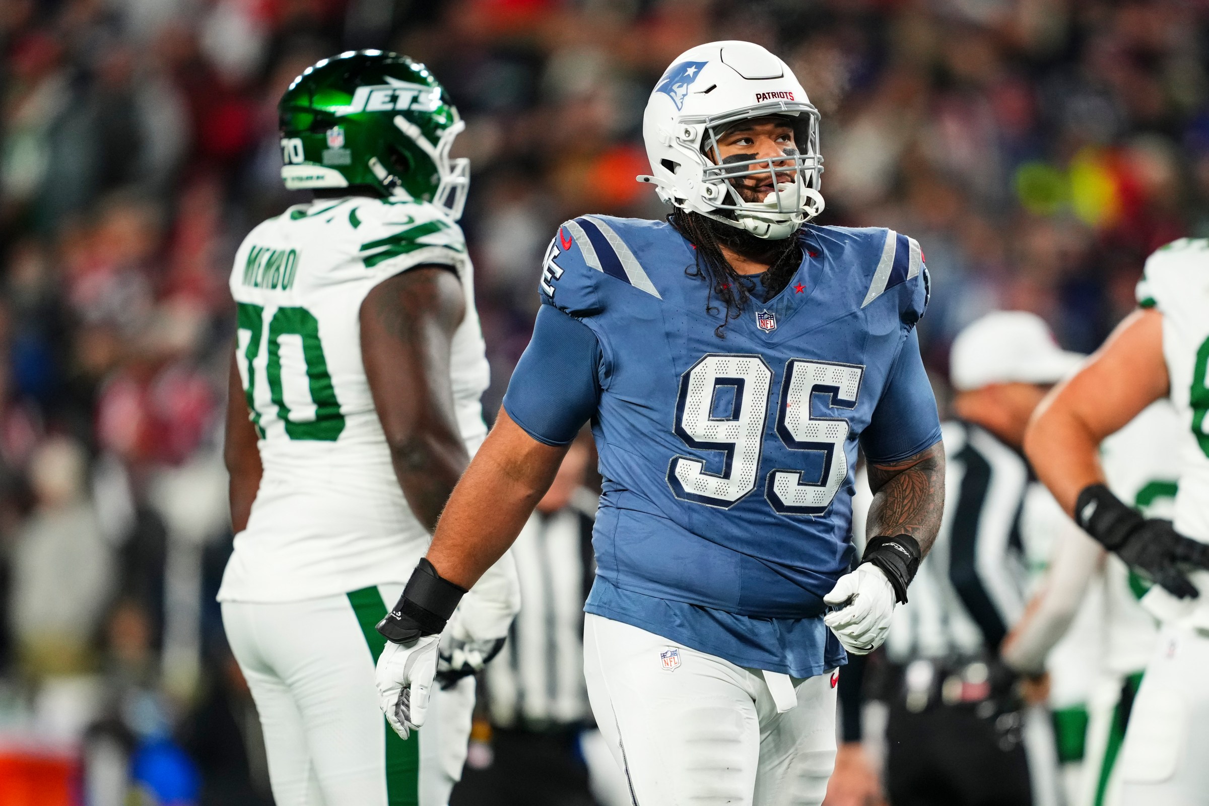 FOXBOROUGH, MA - NOVEMBER 13: Khyiris Tonga #95 of the New England Patriots looks on from the field during an NFL football game against the New York Jets at Gillette Stadium on November 13, 2025 in Foxborough, Massachusetts. (Photo by Cooper Neill/Getty Images)