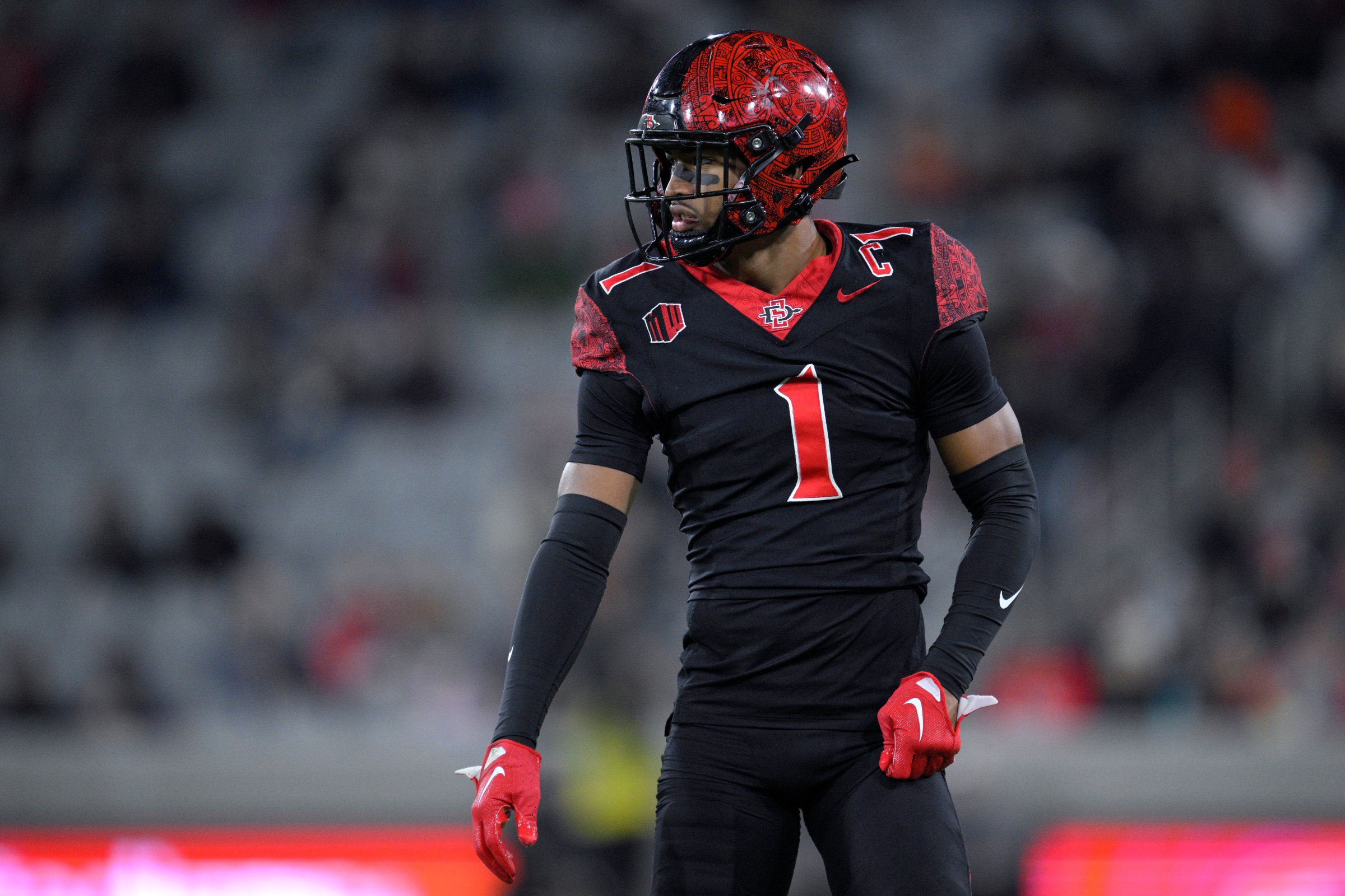 SAN DIEGO, CALIFORNIA - NOVEMBER 22: Chris Johnson #1 of the San Diego State Aztecs looks on during the first half against the San Jose State Spartans at Snapdragon Stadium on November 22, 2025 in San Diego, California. (Photo by Orlando Ramirez/Getty Images)