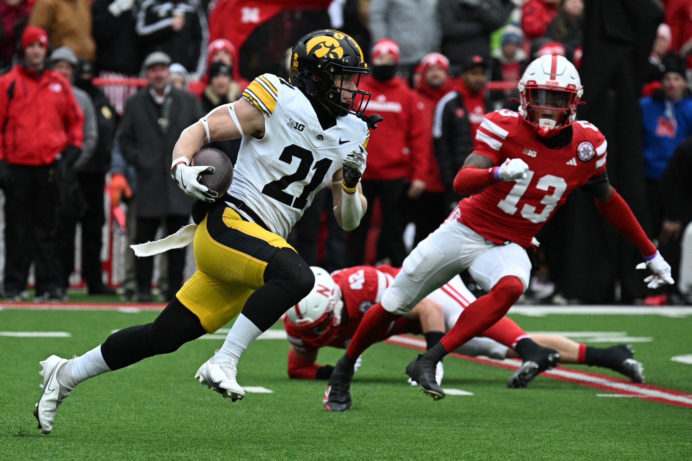 LINCOLN, NEBRASKA - NOVEMBER 28: Kaden Wetjen #21 of the Iowa Hawkeyes returns a kick against the Nebraska Cornhuskers during the first half at Memorial Stadium on November 28, 2025 in Lincoln, Nebraska. (Photo by Steven Branscombe/Getty Images)