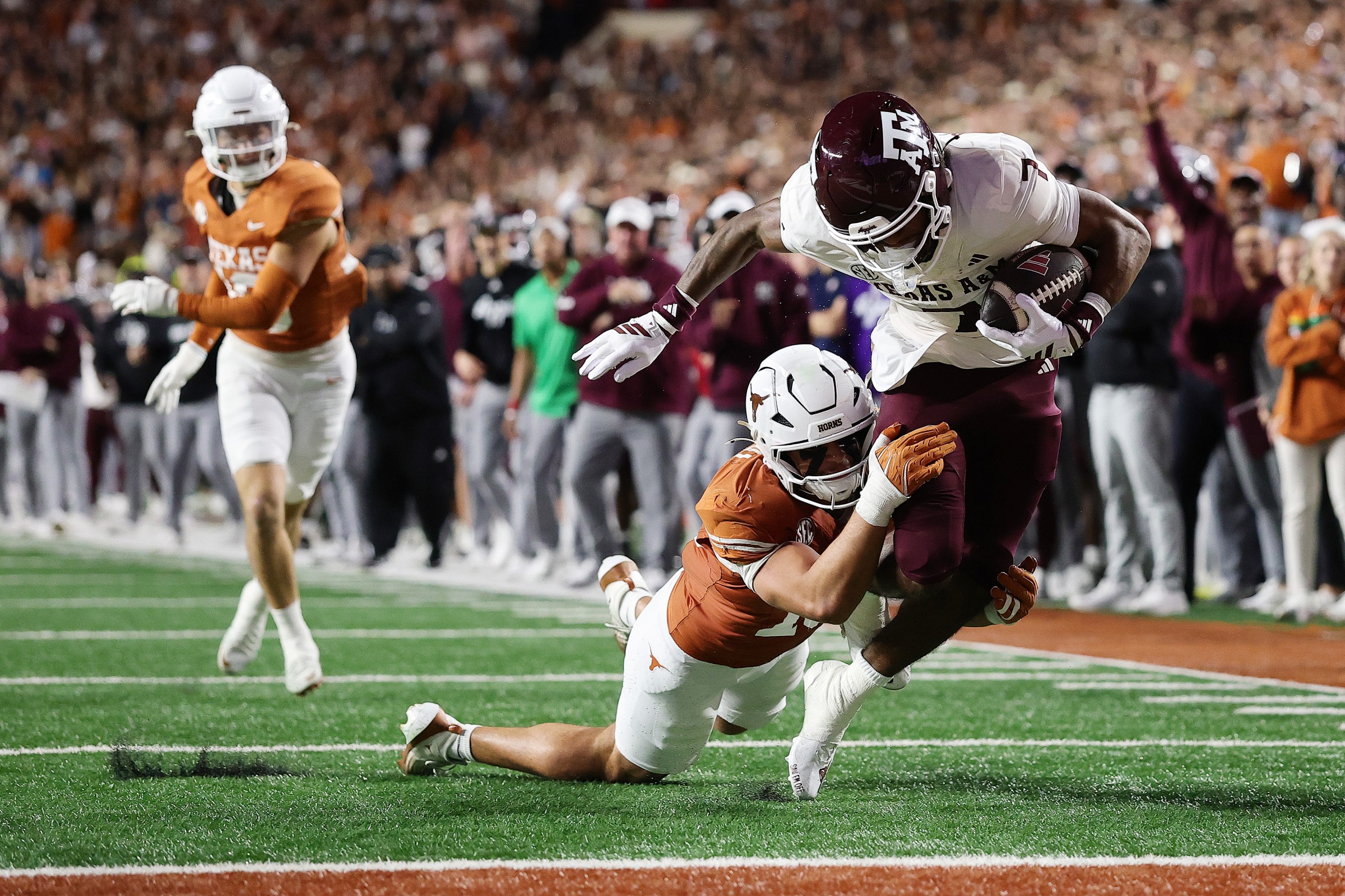 AUSTIN, TEXAS - NOVEMBER 28: KC Concepcion #7 of the Texas A&M Aggies carries for a touchdown during the second quarter against the Texas Longhorns at Darrell K Royal-Texas Memorial Stadium on November 28, 2025 in Austin, Texas. (Photo by Alex Slitz/Getty Images)