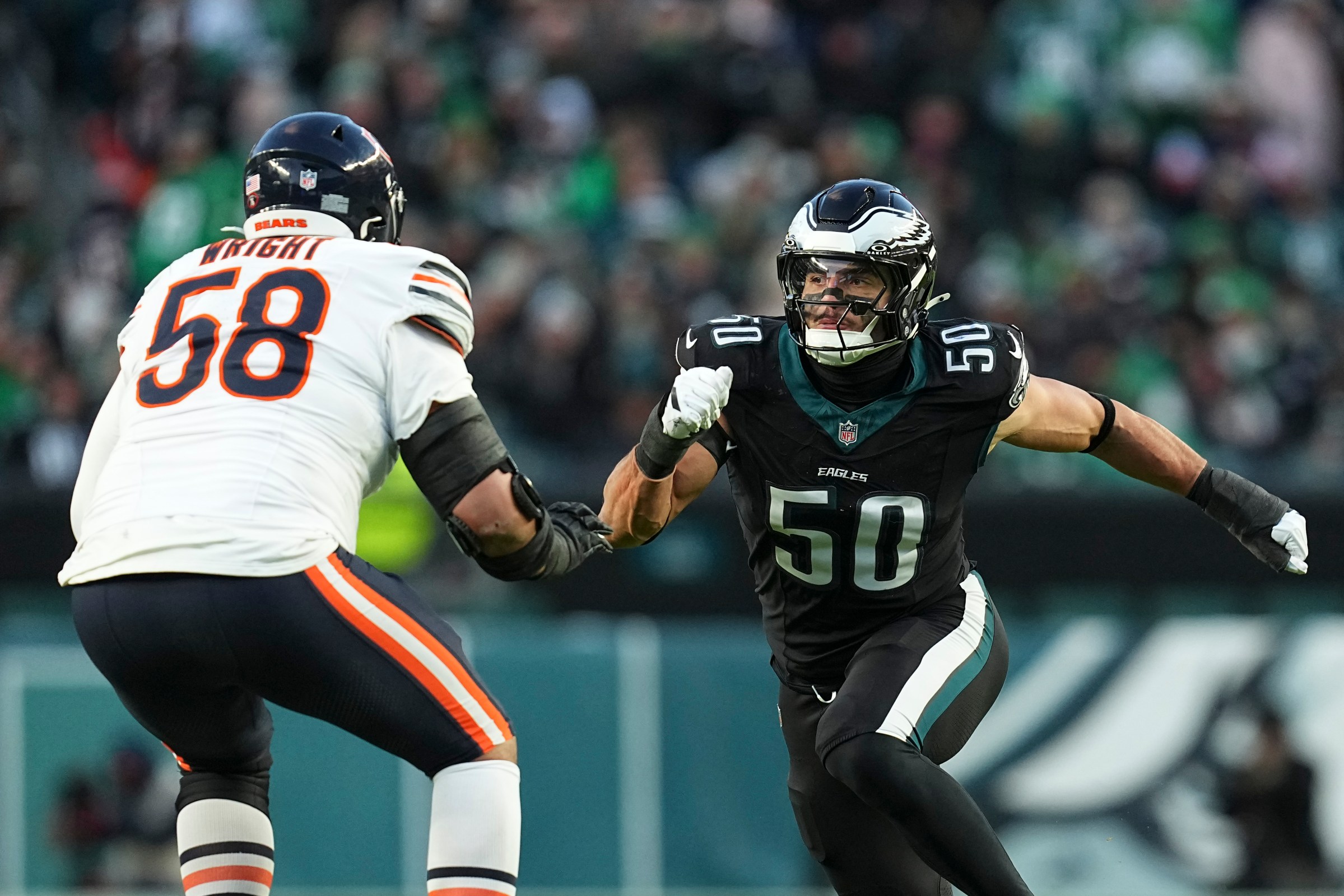 PHILADELPHIA, PENNSYLVANIA - NOVEMBER 28: Jaelan Phillips #50 of the Philadelphia Eagles rushes the passer against Darnell Wright #58 of the Chicago Bears at Lincoln Financial Field on November 28, 2025 in Philadelphia, United States. (Photo by Mitchell Leff/Getty Images)