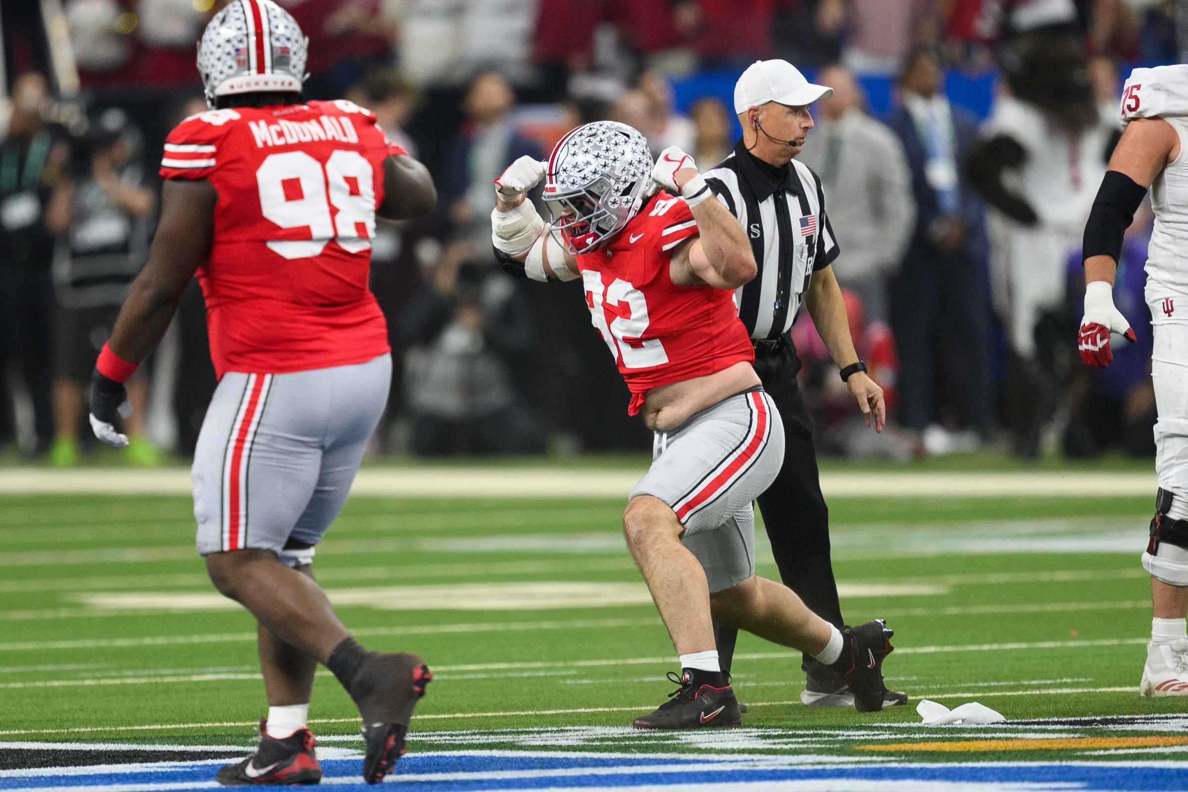 INDIANAPOLIS, IN - DECEMBER 06: Ohio State Buckeyes defensive end Caden Curry (92) celebrates on the field during the Big 10 Championship game between the Ohio State Buckeyes and Indiana Hoosiers on December 6, 2025, at Lucas Oil Stadium in Indianapolis, IN. (Photo by Zach Bolinger/Icon Sportswire via Getty Images)