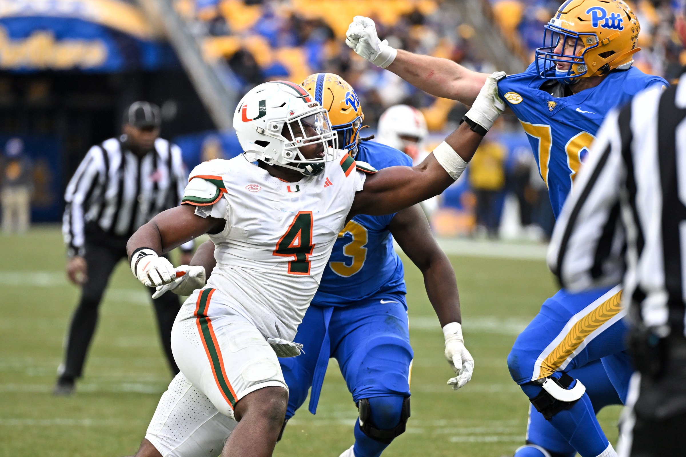 PITTSBURGH, PENNSYLVANIA - NOVEMBER 29, 2025: Rueben Bain Jr. #4 of the Miami Hurricanes rushes against Jeffrey Persi #78 of the Pittsburgh Panthers during the second half at Acrisure Stadium on November 29, 2025 in Pittsburgh, Pennsylvania. (Photo by Chris Bernacchi/Diamond Images via Getty Images)