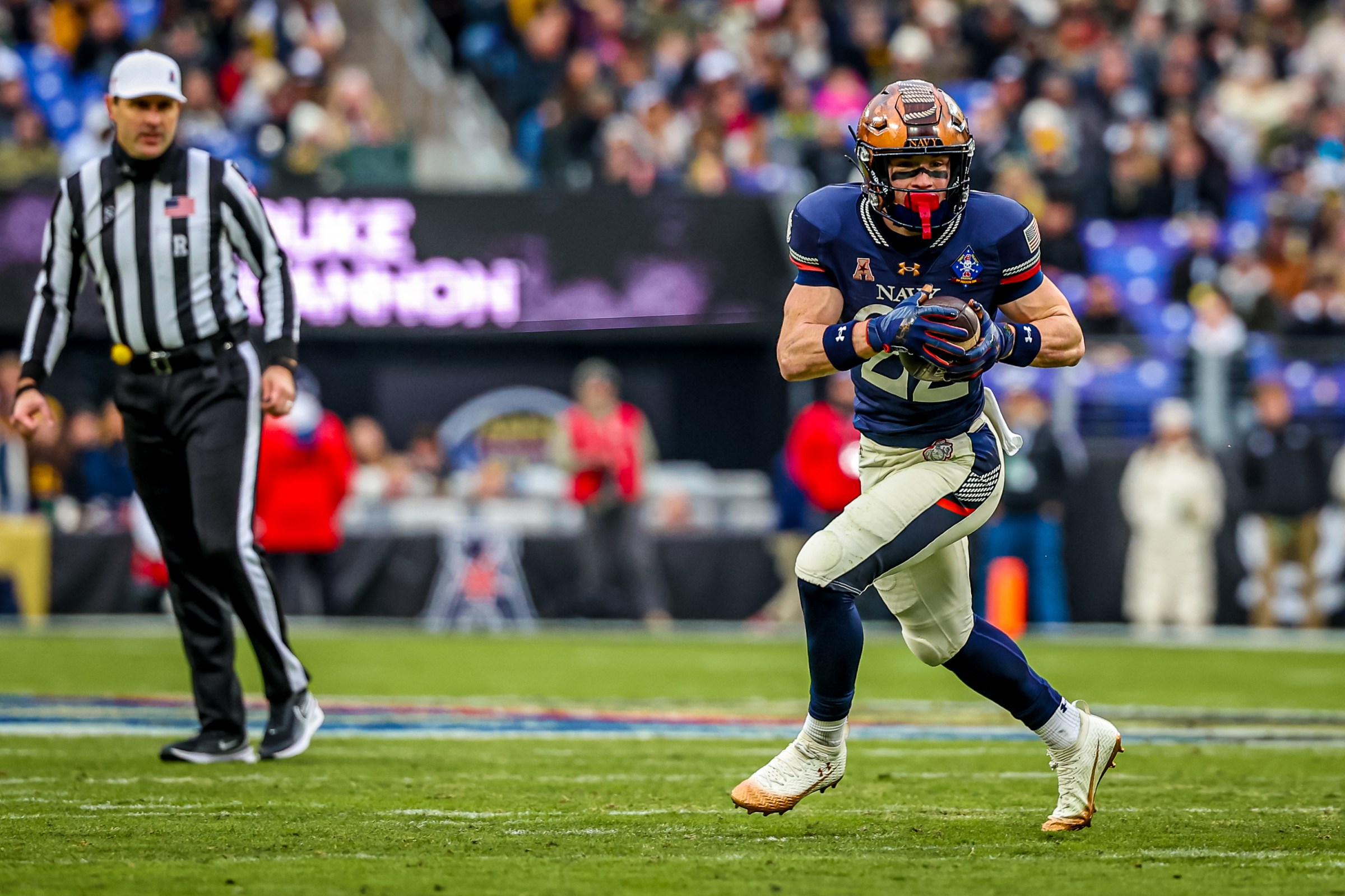 BALTIMORE, MARYLAND - DECEMBER 13: Eli Heidenreich #22 of the Navy Midshipmen runs the ball during the first half of the 126th Army-Navy Game against the Army Black Knights at M&T Bank Stadium on December 13, 2025 in Baltimore, Maryland. (Photo by David Jensen/Getty Images)