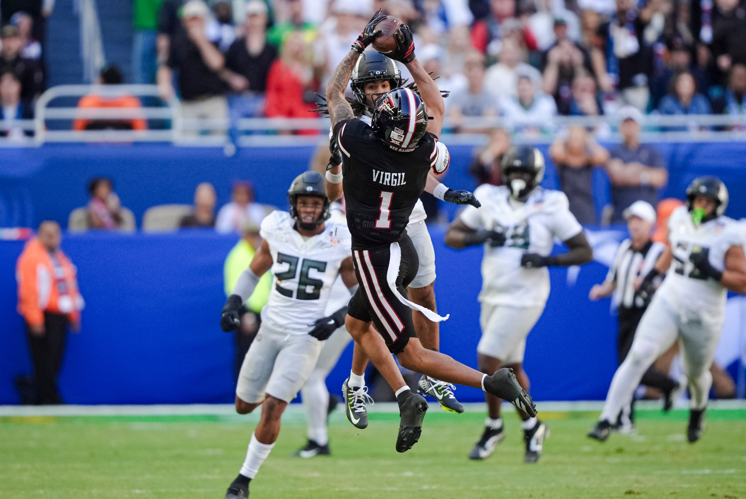 MIAMI GARDENS, FLORIDA - JANUARY 1: Reggie Virgil #1 of the Texas Tech Red Raiders makes a catch during the third quarter against the Oregon Ducks in the College Football Playoff Quarter Final Game at Hard Rock Stadium on January 1, 2026 in Miami Gardens, Florida. (Photo by CFP/Getty Images)