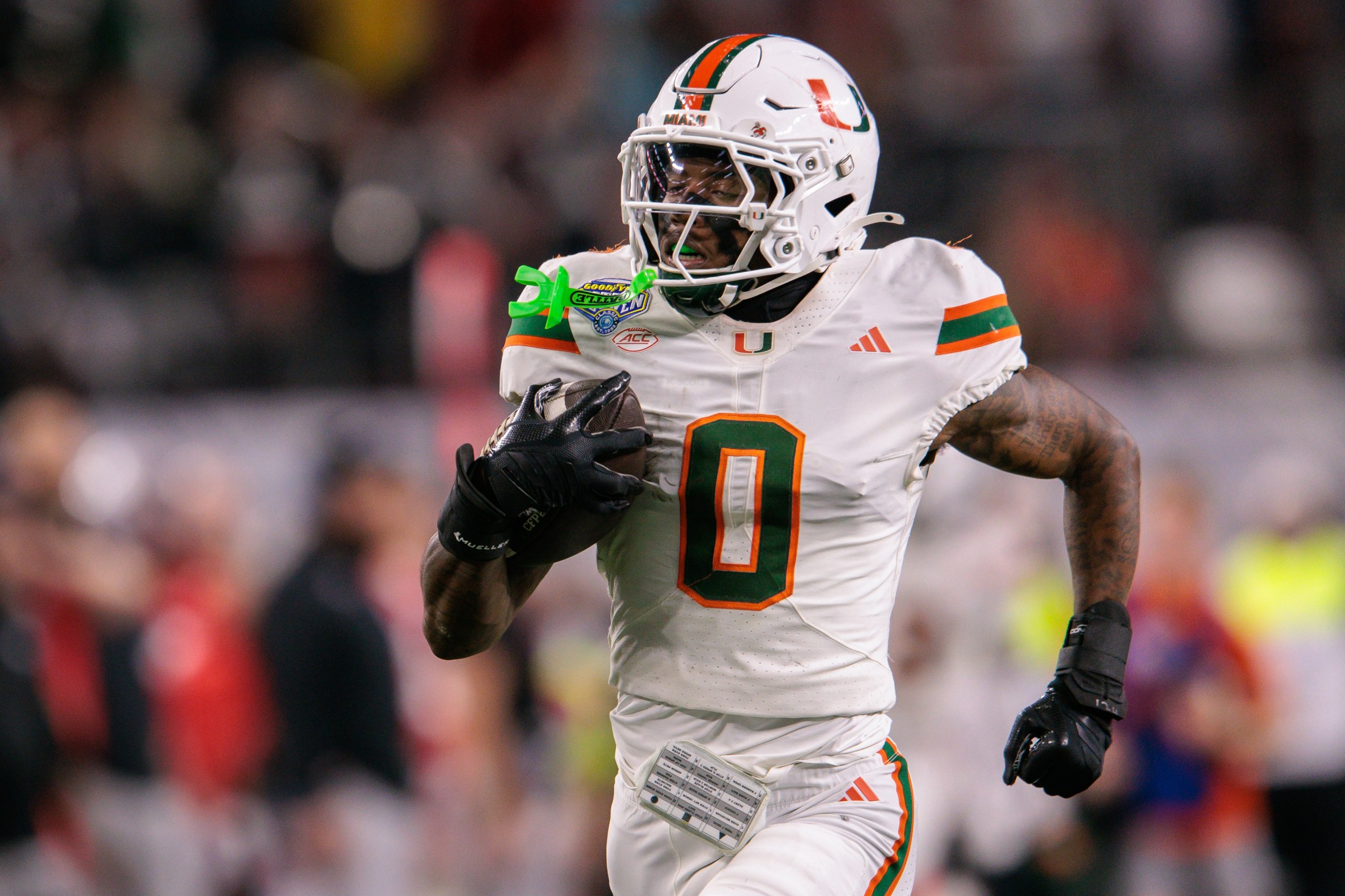 ARLINGTON, TX - DECEMBER 31: DB Keionte Scott #0 of the Miami Hurricanes runs the ball after an interception agains the Ohio State Buckeyes on December 31st, 2025 during the College Football Playoff Quarterfinal at the Goodyear Cotton Bowl Classic between the Miami Hurricanes and the Ohio State Buckeyes on December 31, 2025, at AT&T Stadium in Arlington, TX. (Photo by William Purnell/Icon Sportswire via Getty Images)