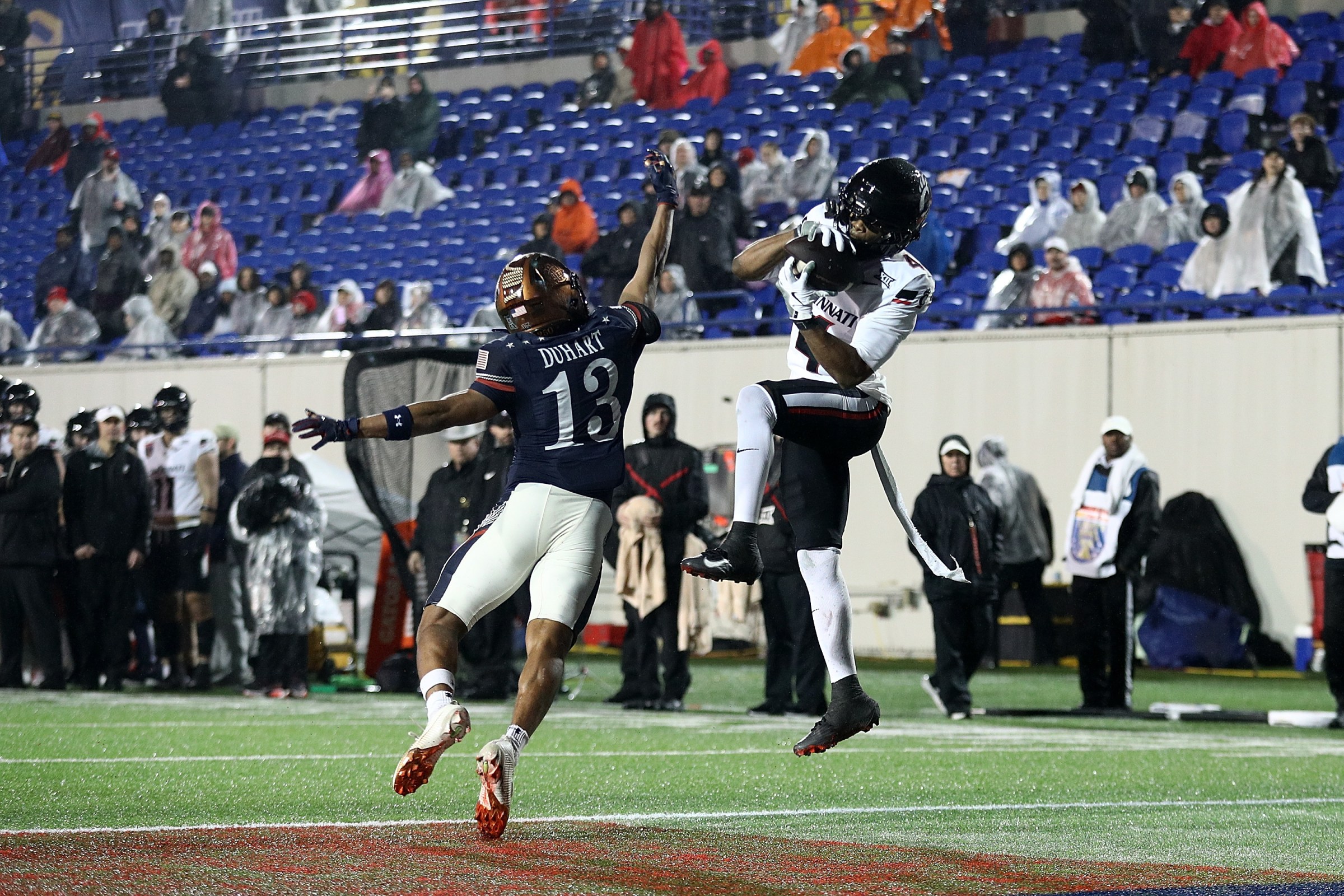 MEMPHIS, TENNESSEE - JANUARY 02: Cyrus Allen #4 of the Cincinnati Bearcats catches a touchdown pass during the second half of the 2026 AutoZone Liberty Bowl against Andrew Duhart #13 of the Navy Midshipmen at Simmons Bank Liberty Stadium on January 02, 2026 in Memphis, Tennessee. (Photo by Justin Ford/Getty Images)