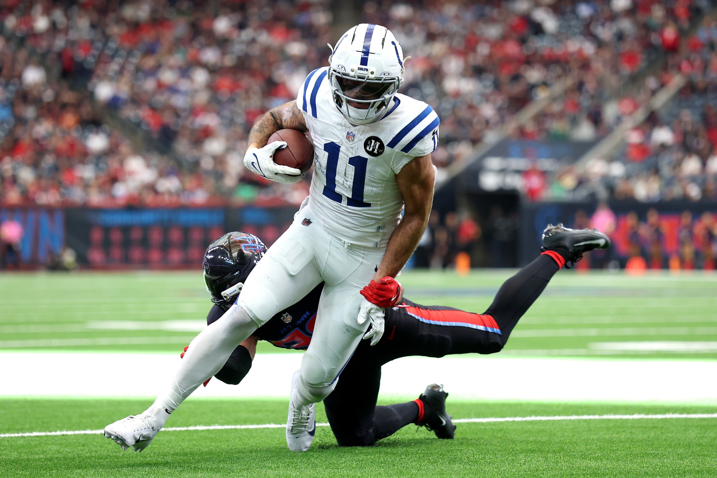 HOUSTON, TEXAS - JANUARY 04: Michael Pittman Jr. #11 of the Indianapolis Colts in action against the Houston Texans at NRG Stadium on January 04, 2026 in Houston, Texas. (Photo by Tim Warner/Getty Images)