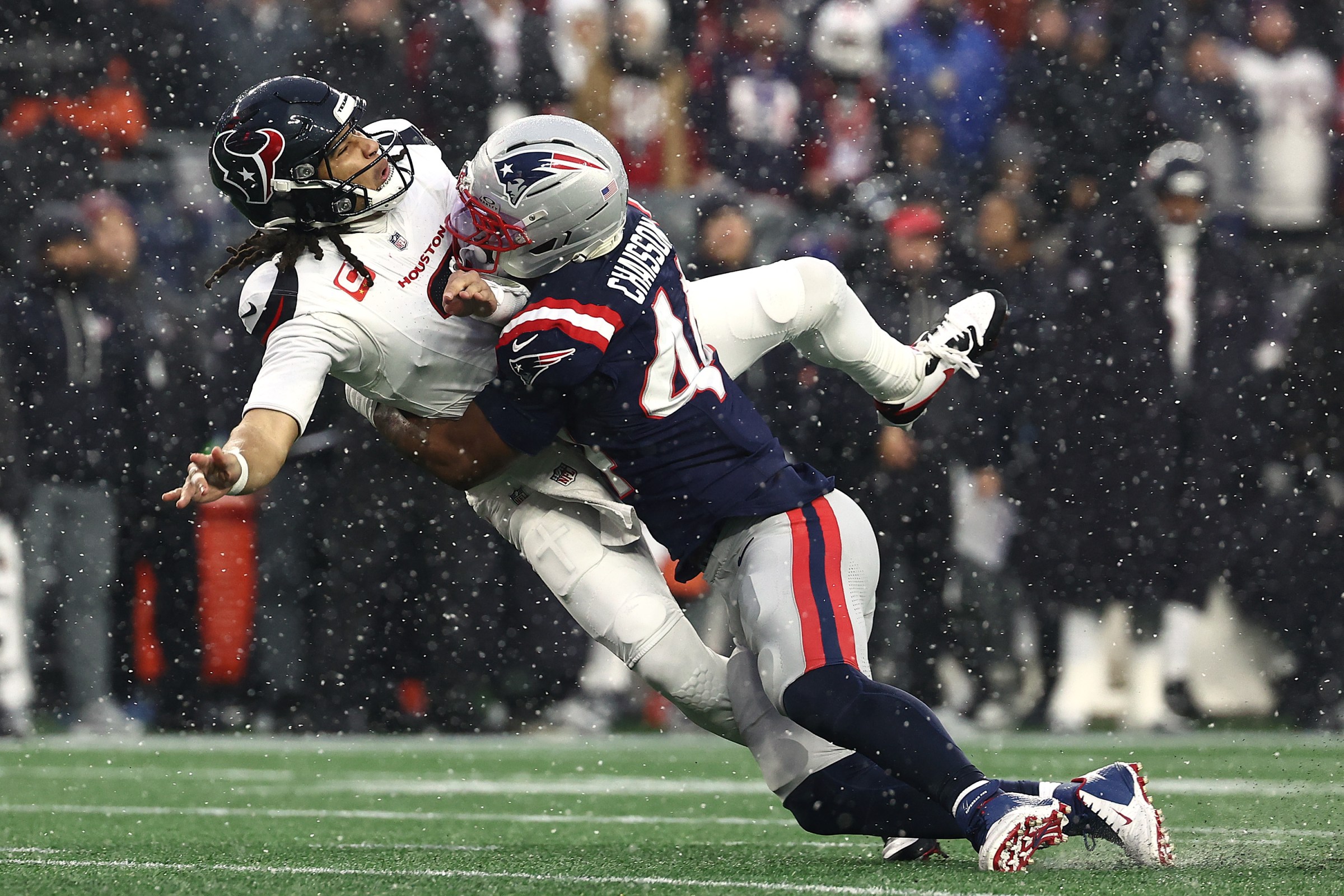 FOXBOROUGH, MASSACHUSETTS - JANUARY 18: K’lavon Chaisson #44 of the New England Patriots hits C.J. Stroud #7 of the Houston Texans as he throws a pass during the second quarter in the AFC Divisional Playoff game at Gillette Stadium on January 18, 2026 in Foxborough, Massachusetts. (Photo by Winslow Townson/Getty Images)