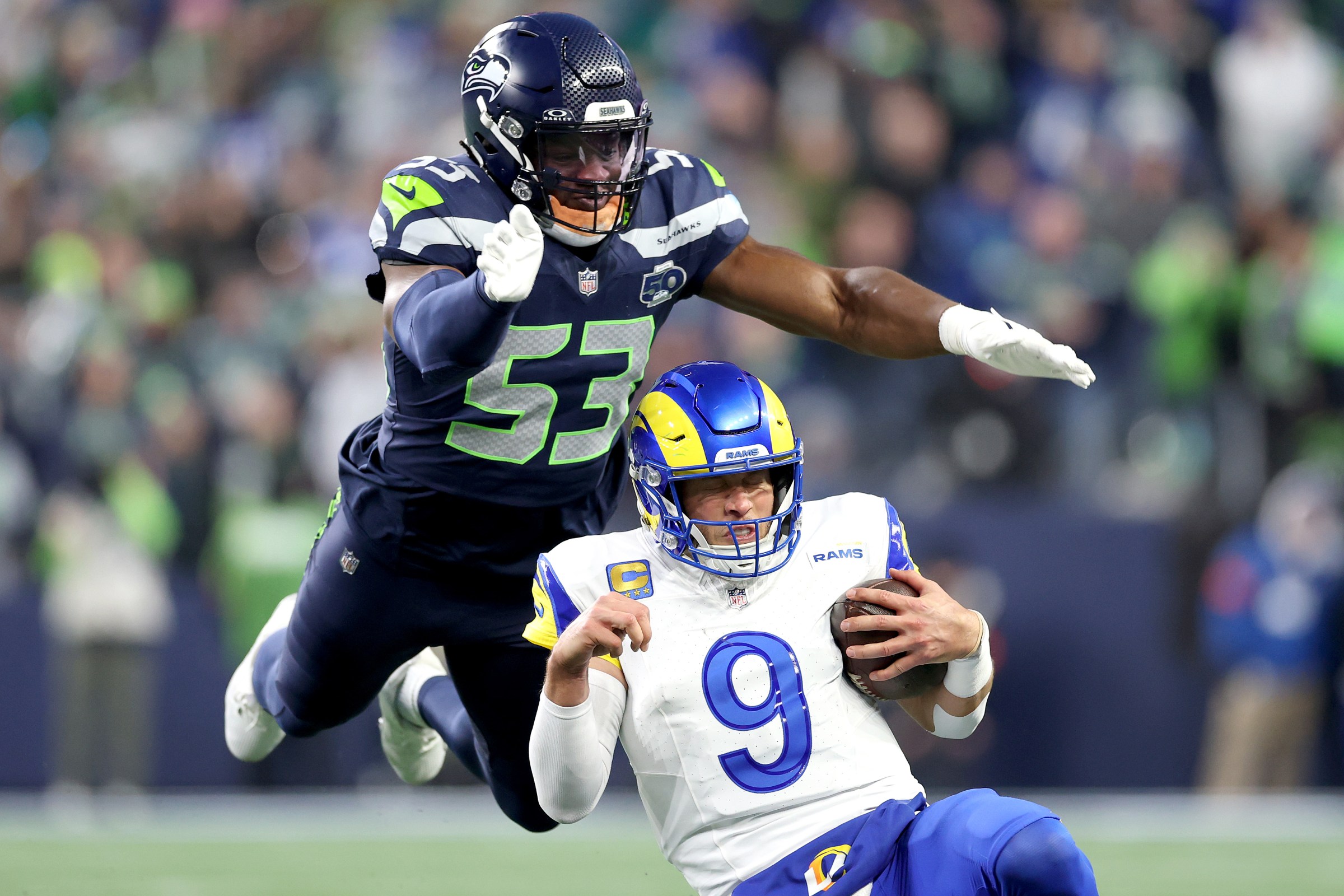 SEATTLE, WASHINGTON - JANUARY 25: Boye Mafe #53 of the Seattle Seahawks tackles Matthew Stafford #9 of the Los Angeles Rams in the NFC Championship game at Lumen Field on January 25, 2026 in Seattle, Washington. (Photo by Steph Chambers/Getty Images)