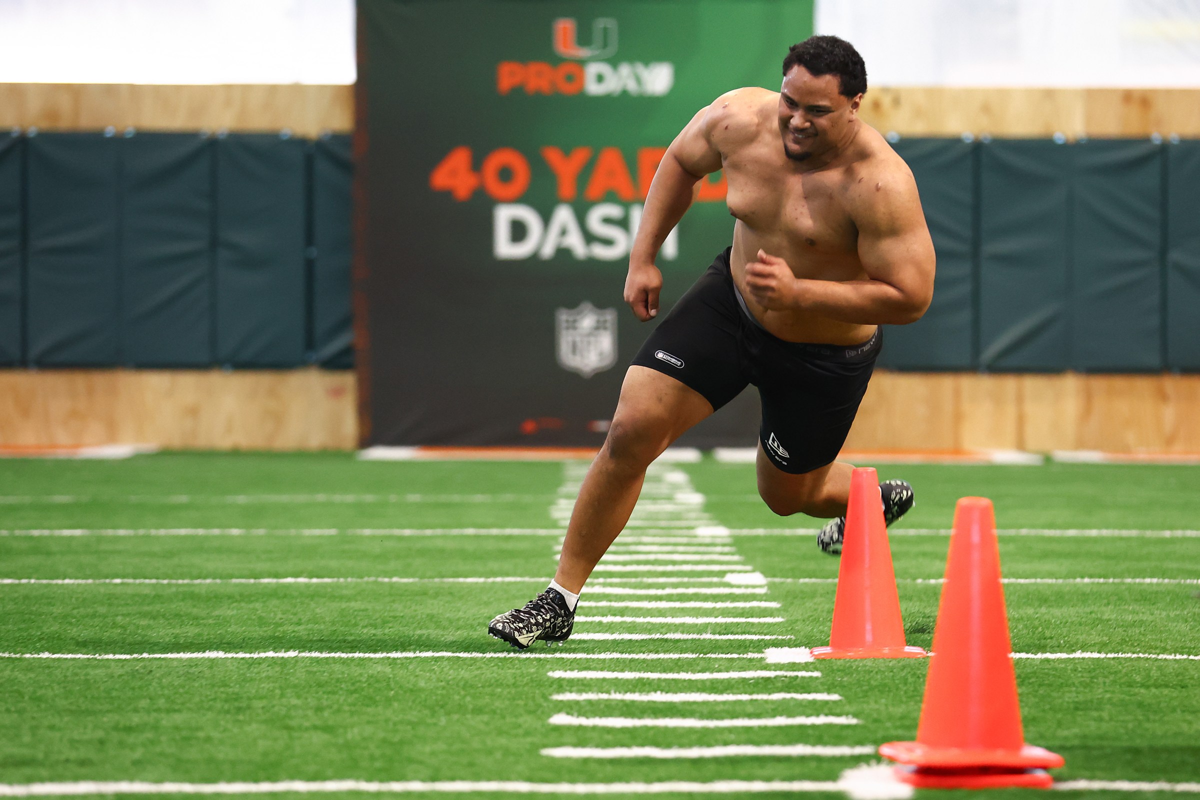 Francis Mauigoa #61 of the Miami Hurricanes competes in a drill during the 2026 Miami Pro Day