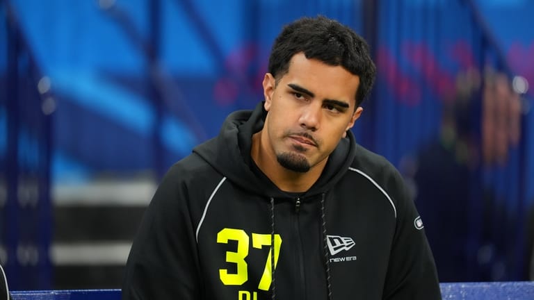 Utah defensive lineman Logan Fano (37) watches as players run...