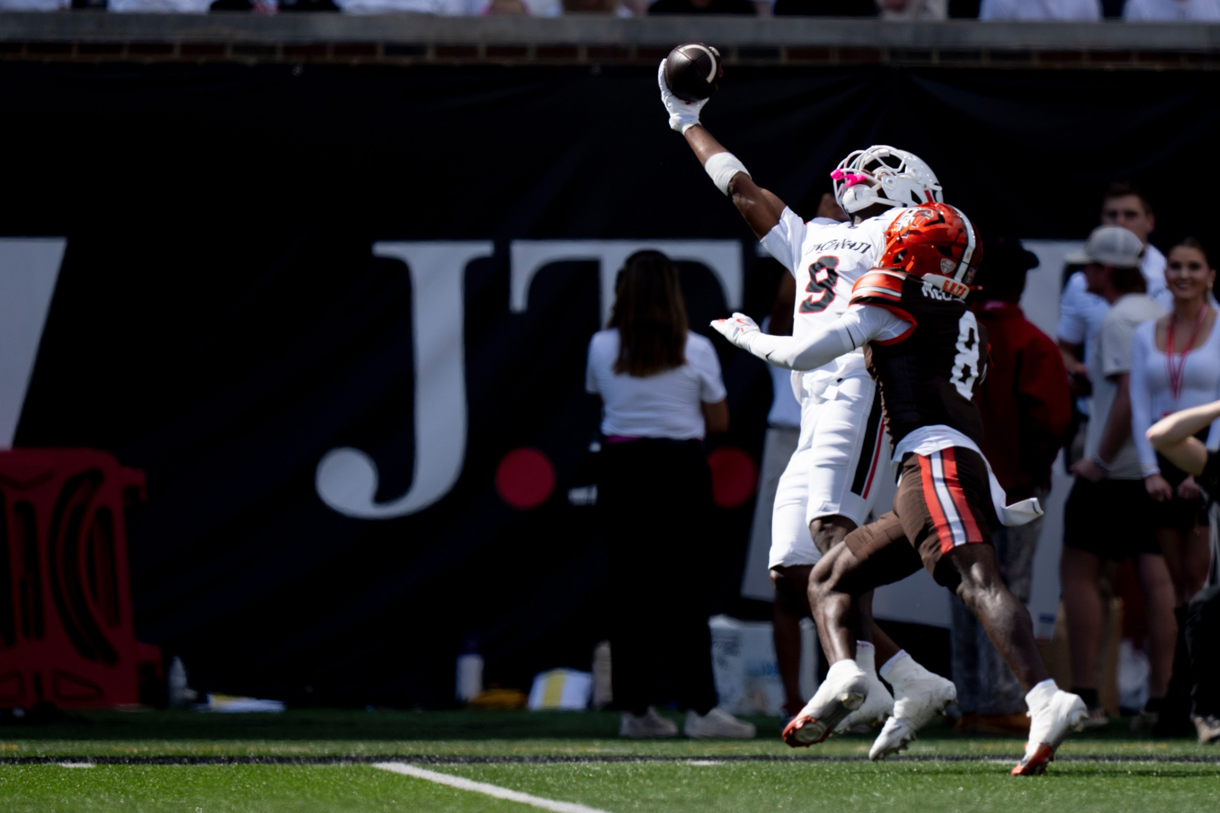 Cincinnati Bearcats wide receiver Jeff Caldwell (9) catches a pass as Bowling Green Falcons cornerback Jalen McClendon (8) defends in the second quarter of the NCAA football game between the Cincinnati Bearcats and Bowling Green Falcons at Nippert Stadium in Cincinnati on Sept. 6, 2025.