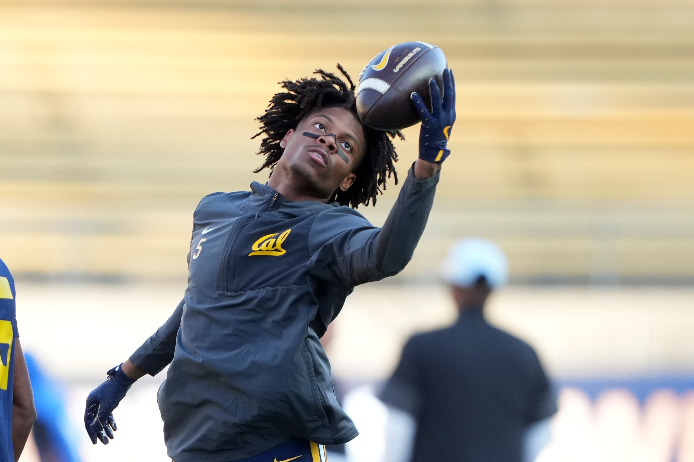 Nov 29, 2025; Berkeley, California, USA; California Golden Bears defensive back Hezekiah Masses (5) warms up before the game against the Southern Methodist Mustangs at California Memorial Stadium. Mandatory Credit: Darren Yamashita-Imagn Images